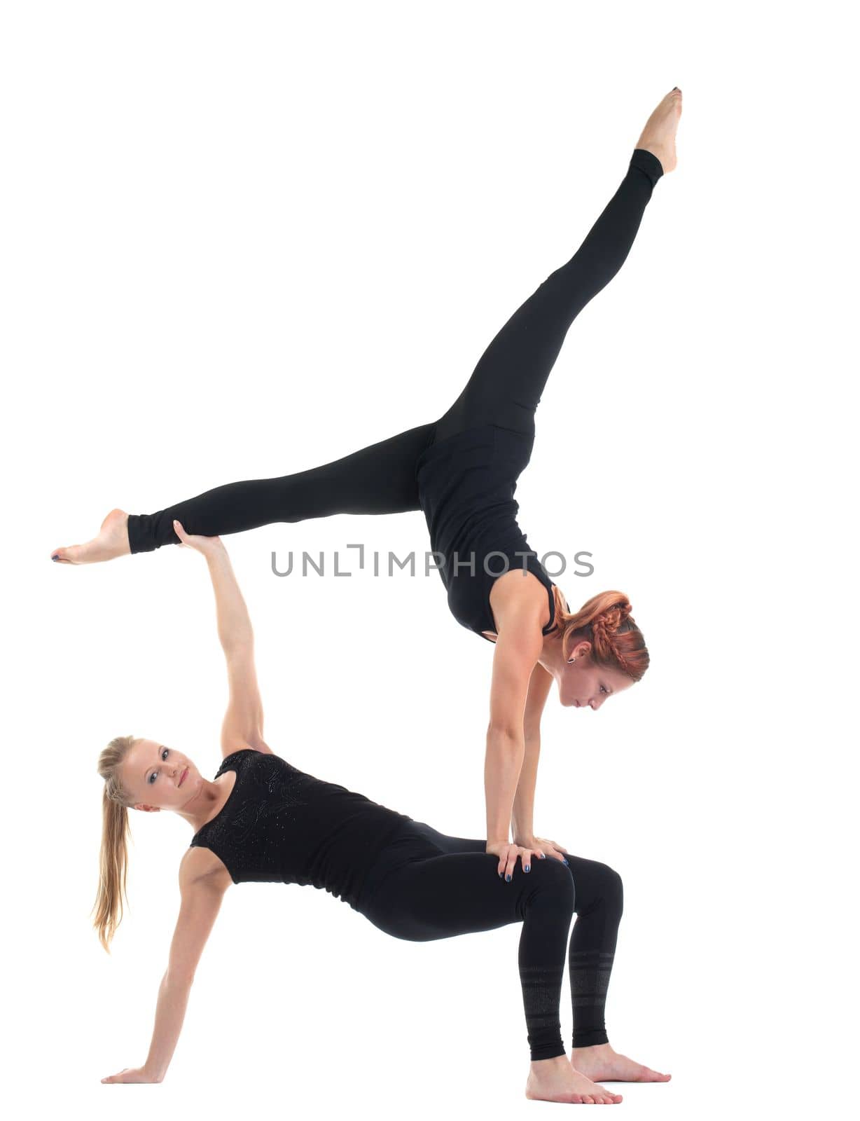 two woman gymnast in black costume show acrobatic exercise isolated