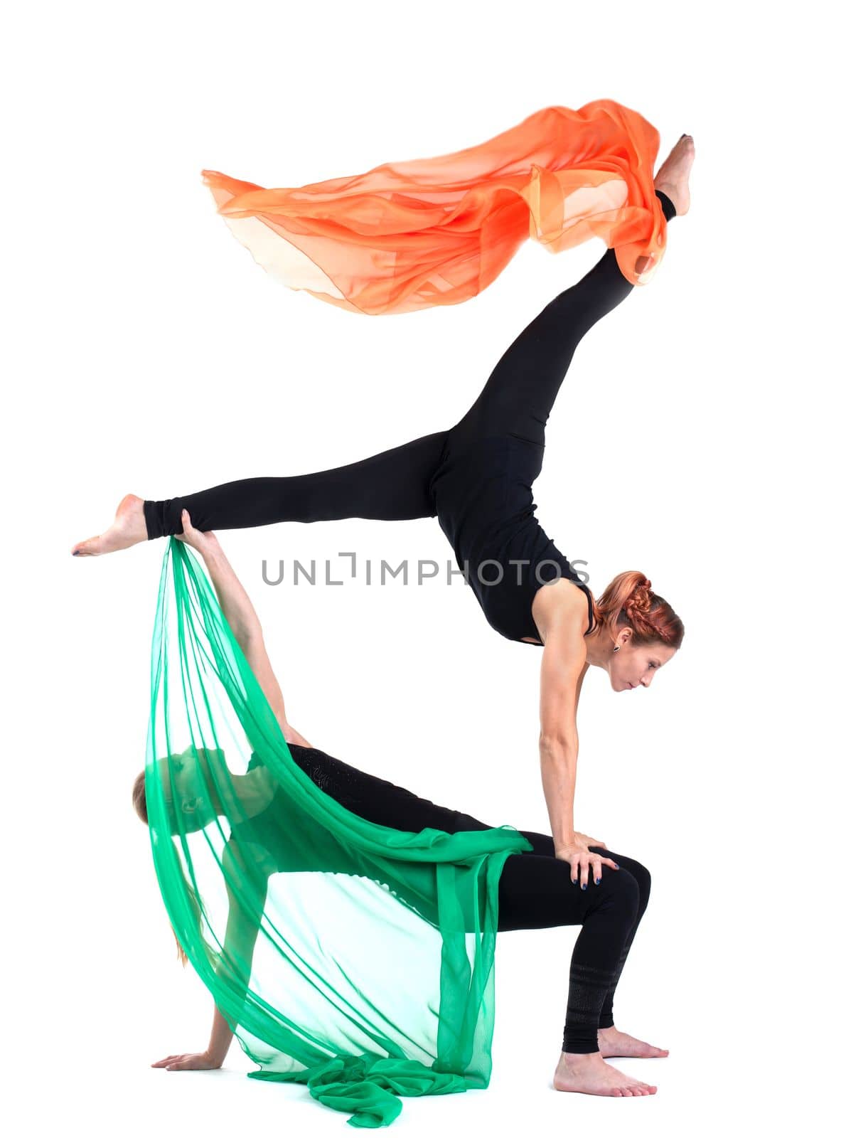 two woman gymnast stand with flying cloth isolated