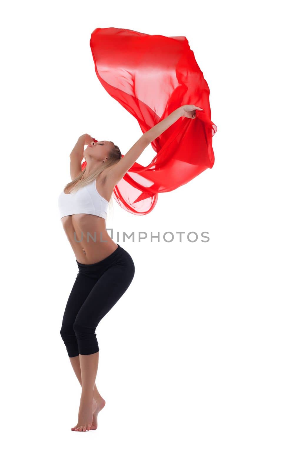 Young blond woman dance with red flying fabric isolated