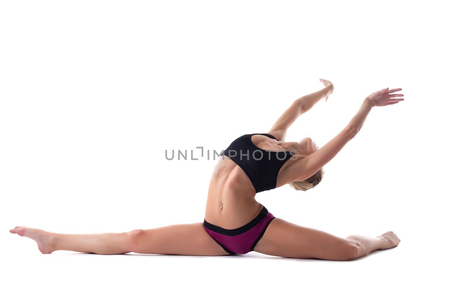 pretty blond woman doing perfect split isolated