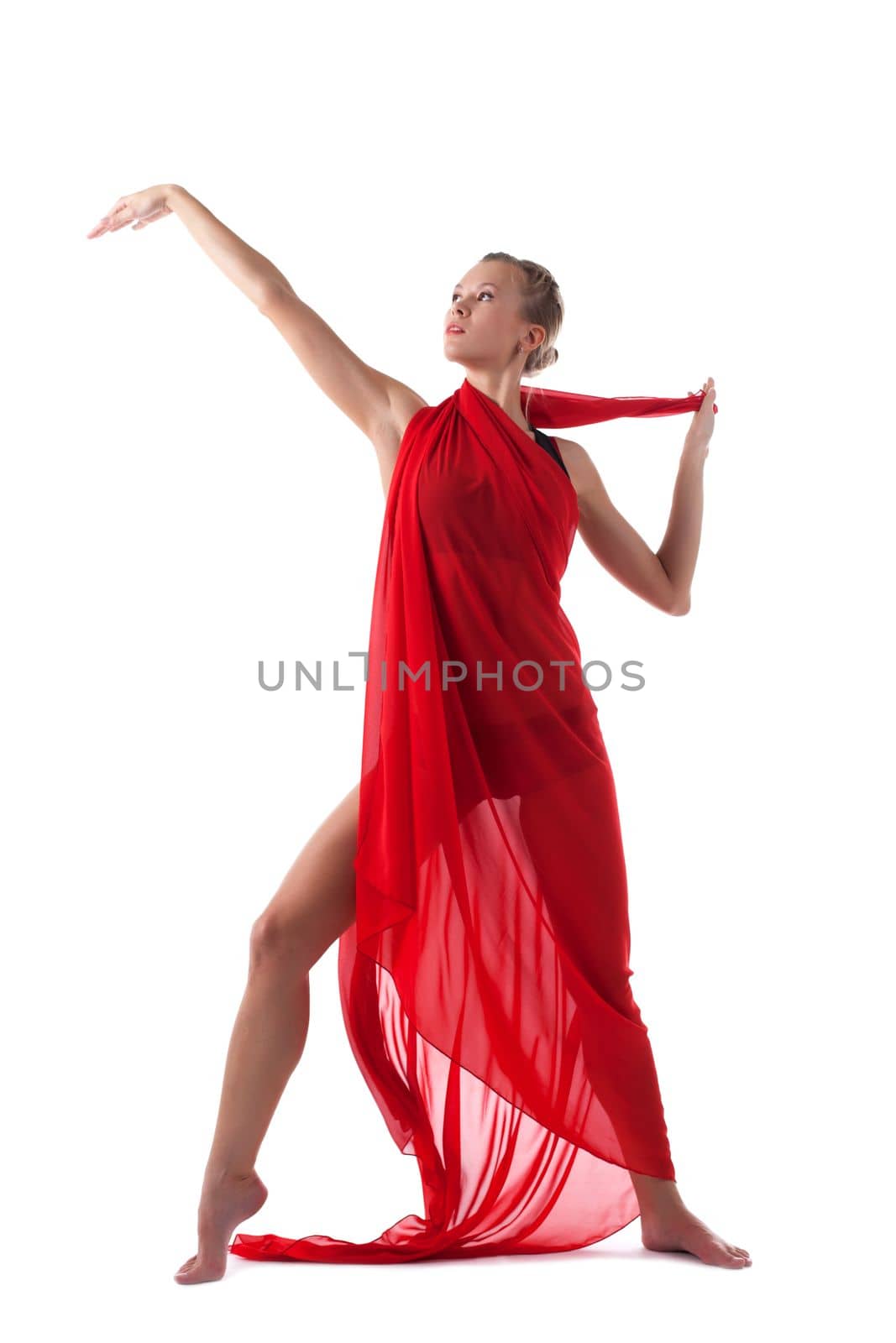 blond woman in fitness costume dance with flying fabric isolated