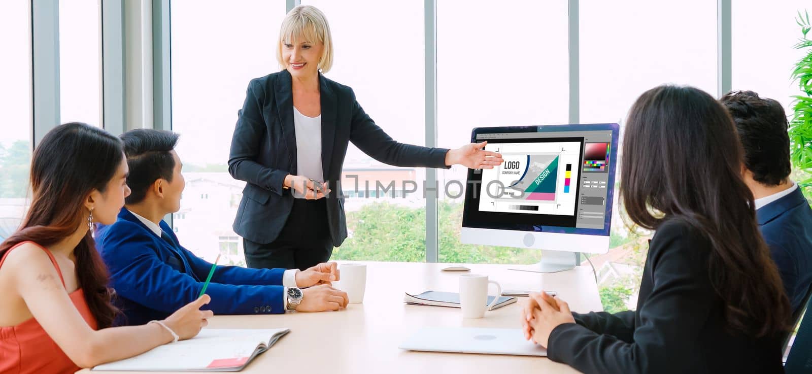 Graphic designer software for modern design of web page and commercial ads showing on the computer screen