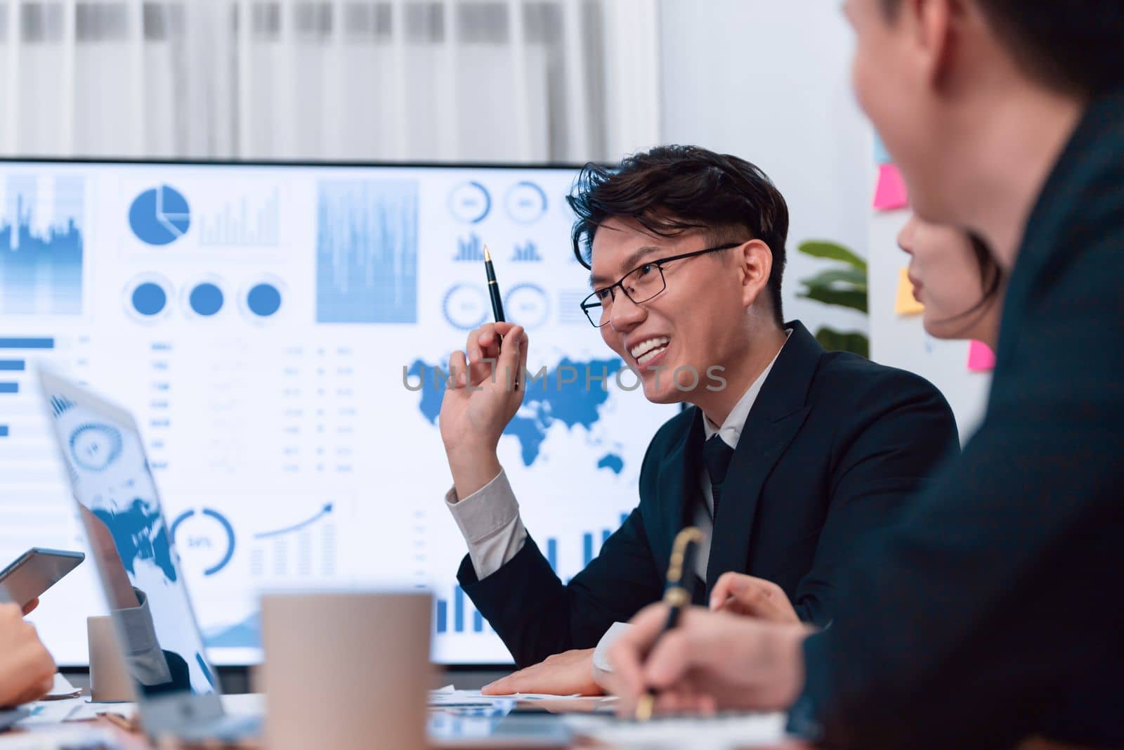 Business team of financial data analysis meeting with business intelligence, report paper and dashboard on laptop for marketing strategy. Business people working together to promote harmony in office.