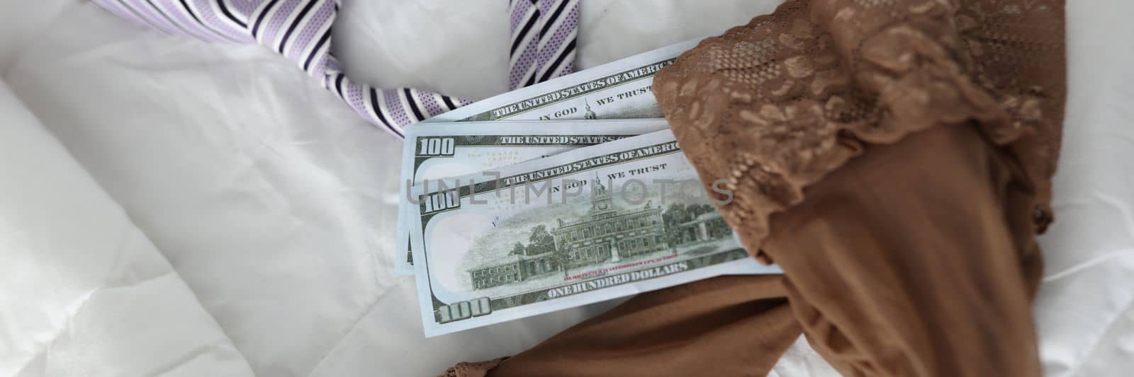 Women stockings men tie and cash dollar bills. Intimate services and sex for money concept