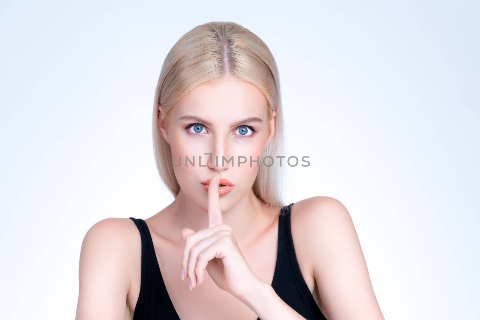 Pretty personable beautiful woman portrait with perfect smooth clean skin and natural makeup portrait in isolated background. Hand gesture with expressive facial expression for beauty model concept.