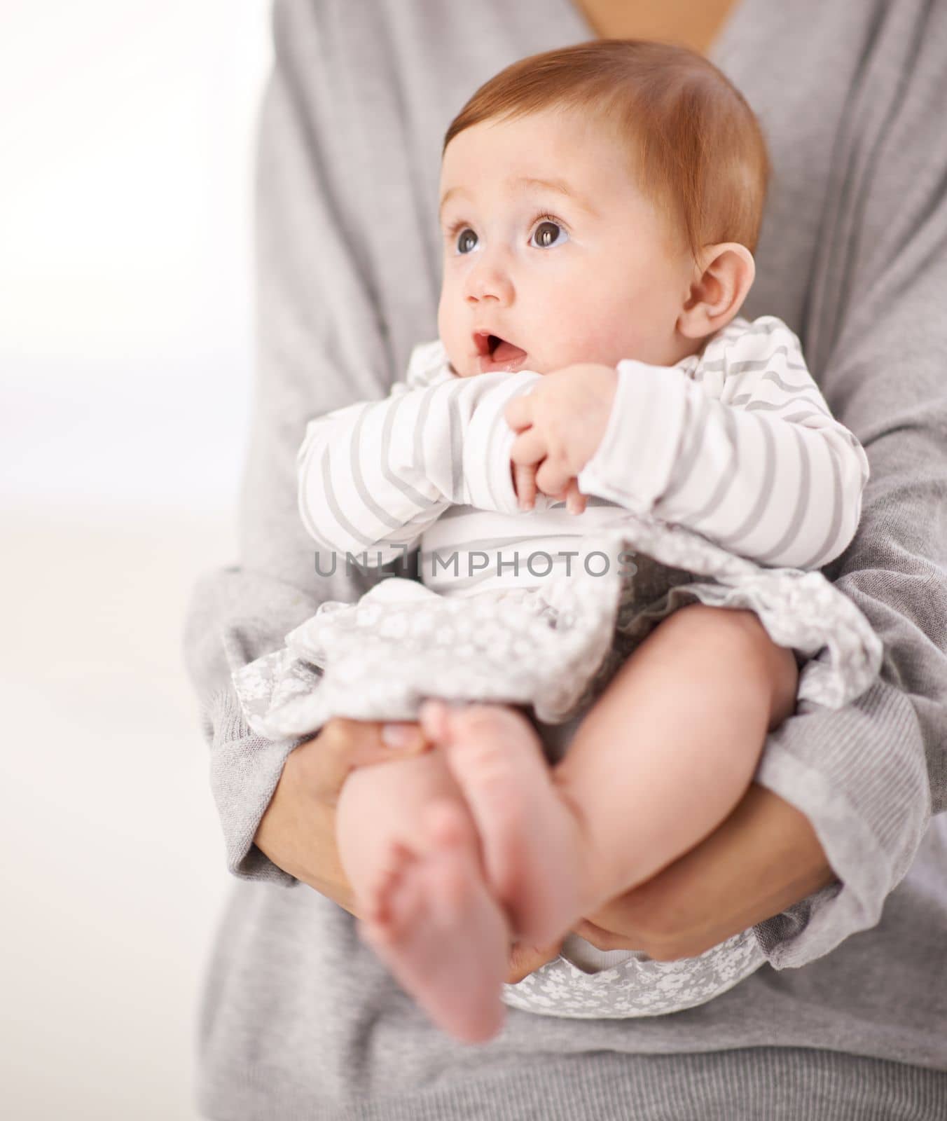 OMG... are you talking to me. Portrait of a baby in her mothers arms