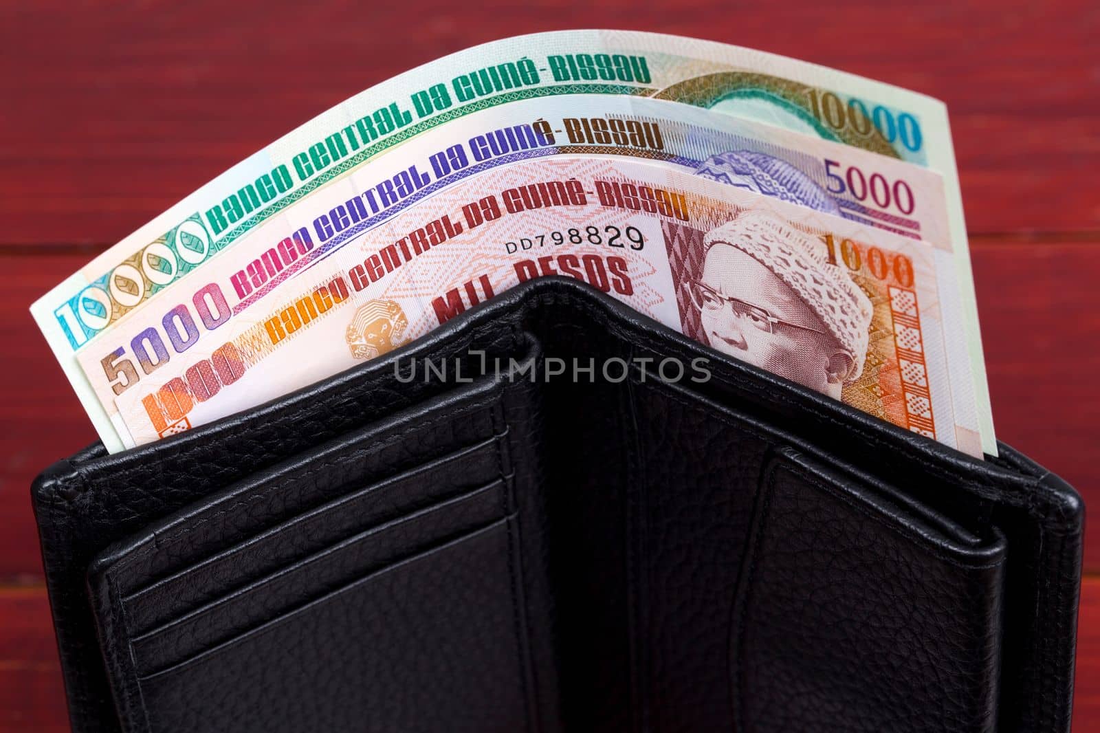 Guinea-Bissau peso in the black wallet by johan10