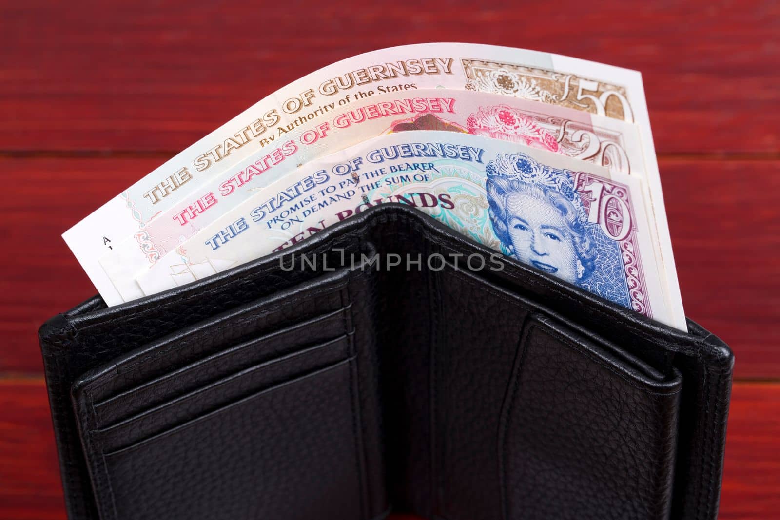 Guernsey money - Pounds  in the black wallet