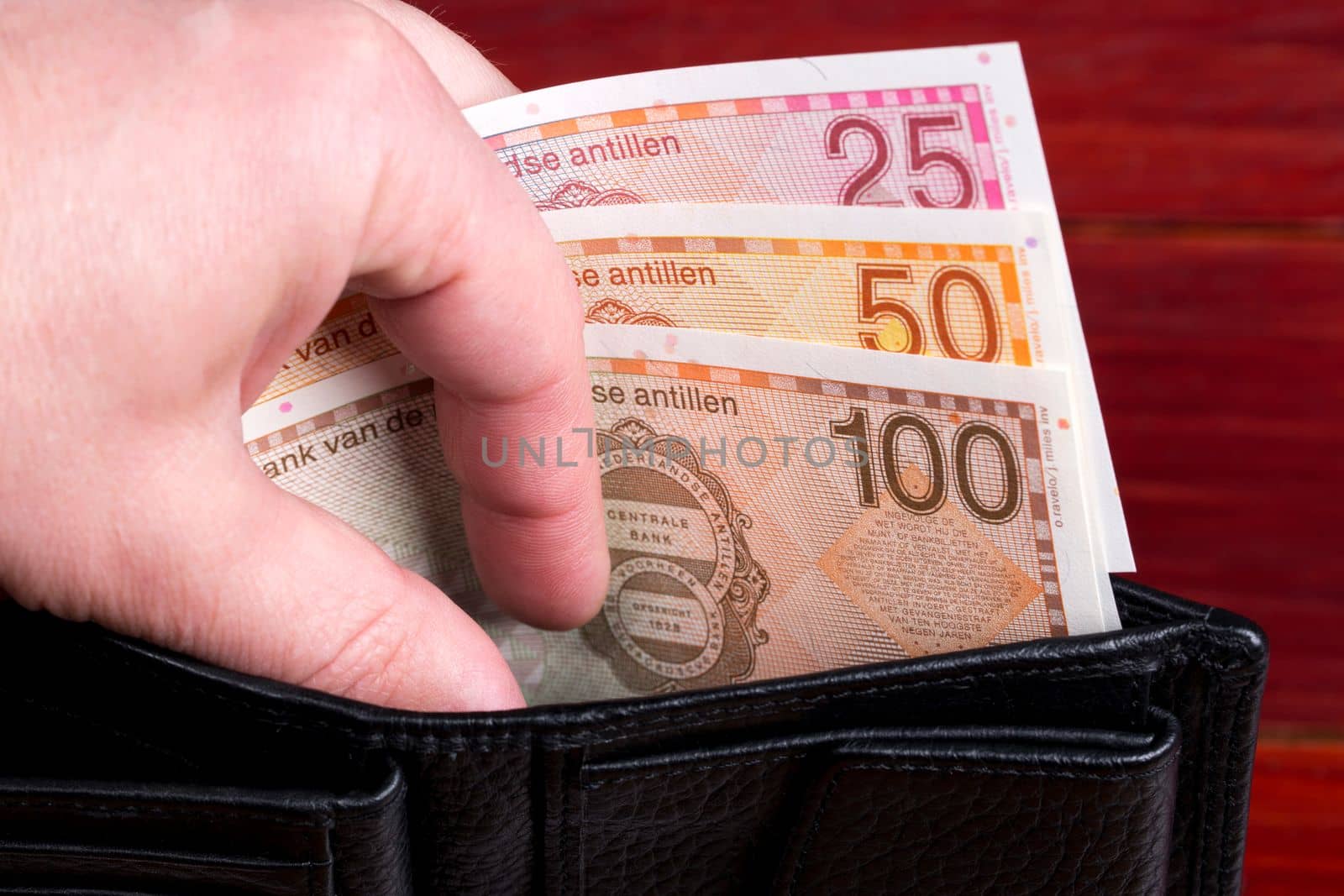 Netherlands Antillean money - guilder in the black wallet