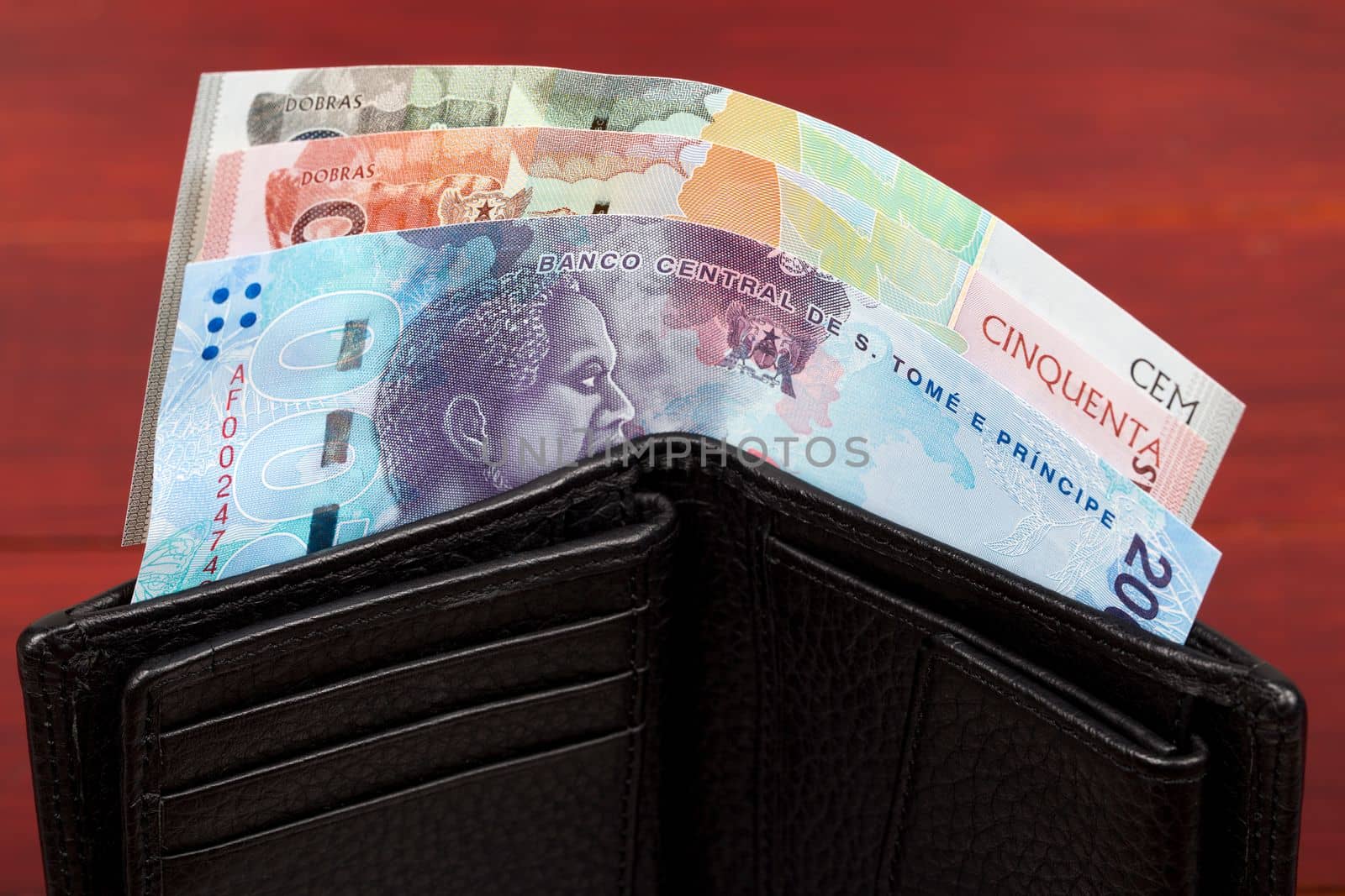 Sao Tome and Principe money - Dobras in black wallet