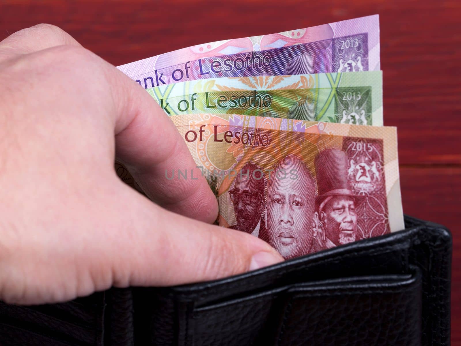 Lesotho money - Loti in the black wallet by johan10