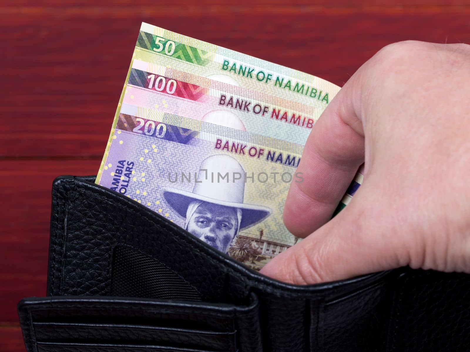 Namibian dollar in the black wallet