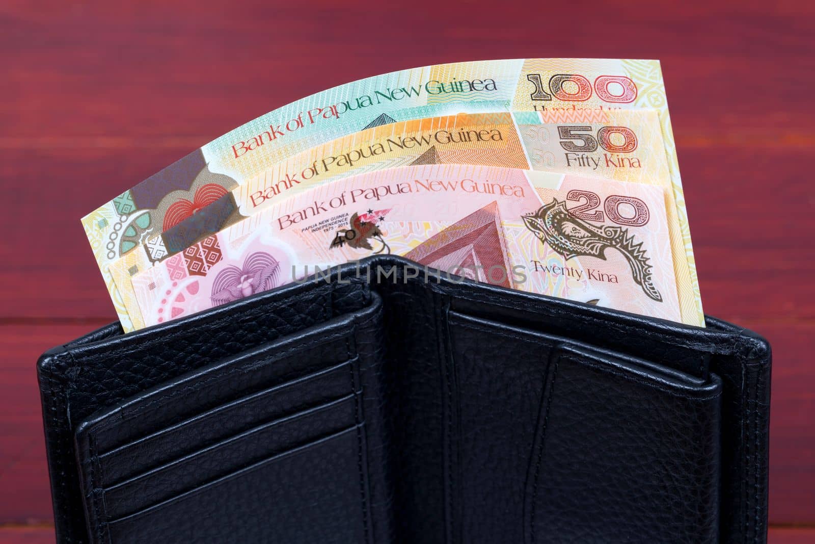 Papua New Guinean money - kina in the black wallet