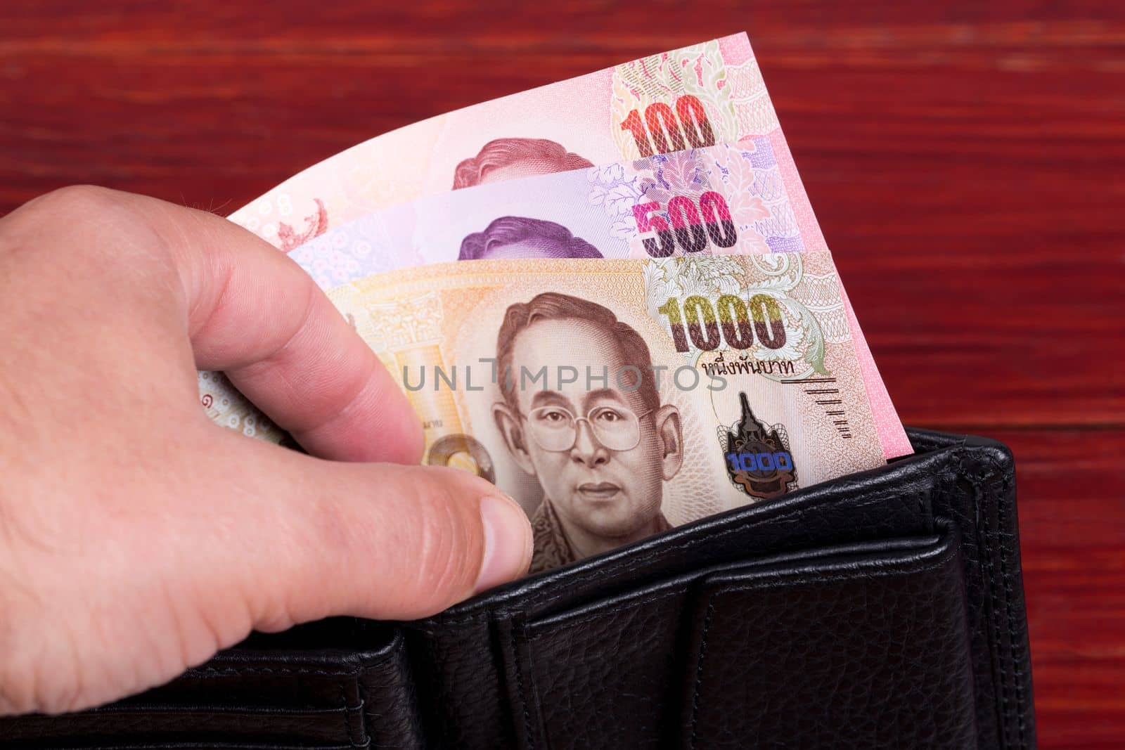 Thai money - baht in the black wallet by johan10