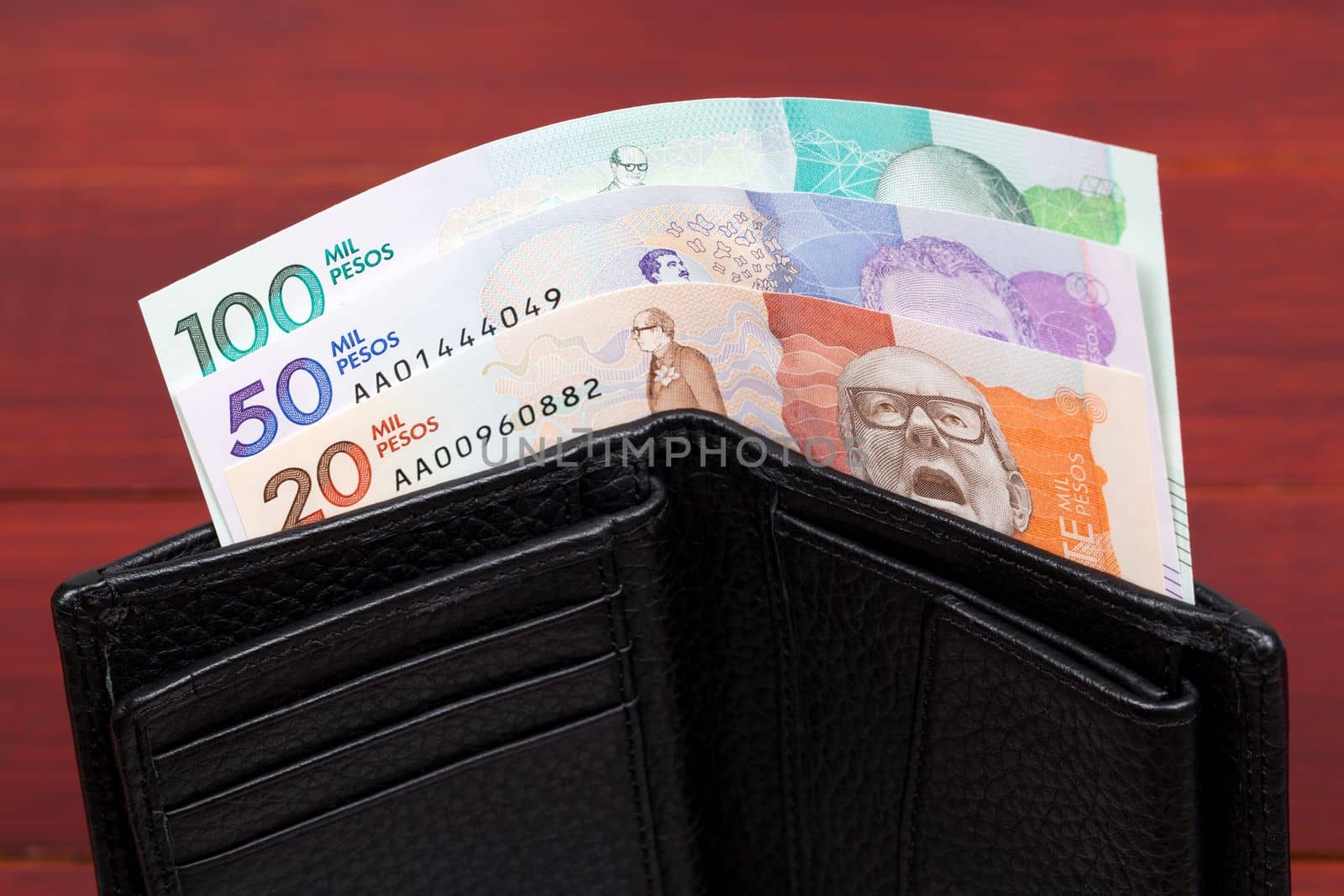 Colombian money - peso in the black wallet by johan10