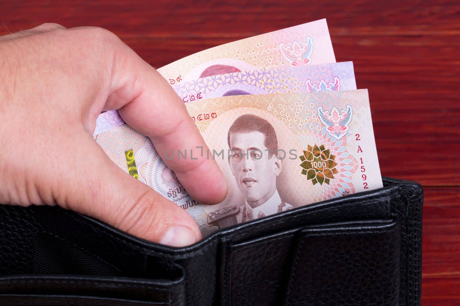 Thai money - baht in the black wallet