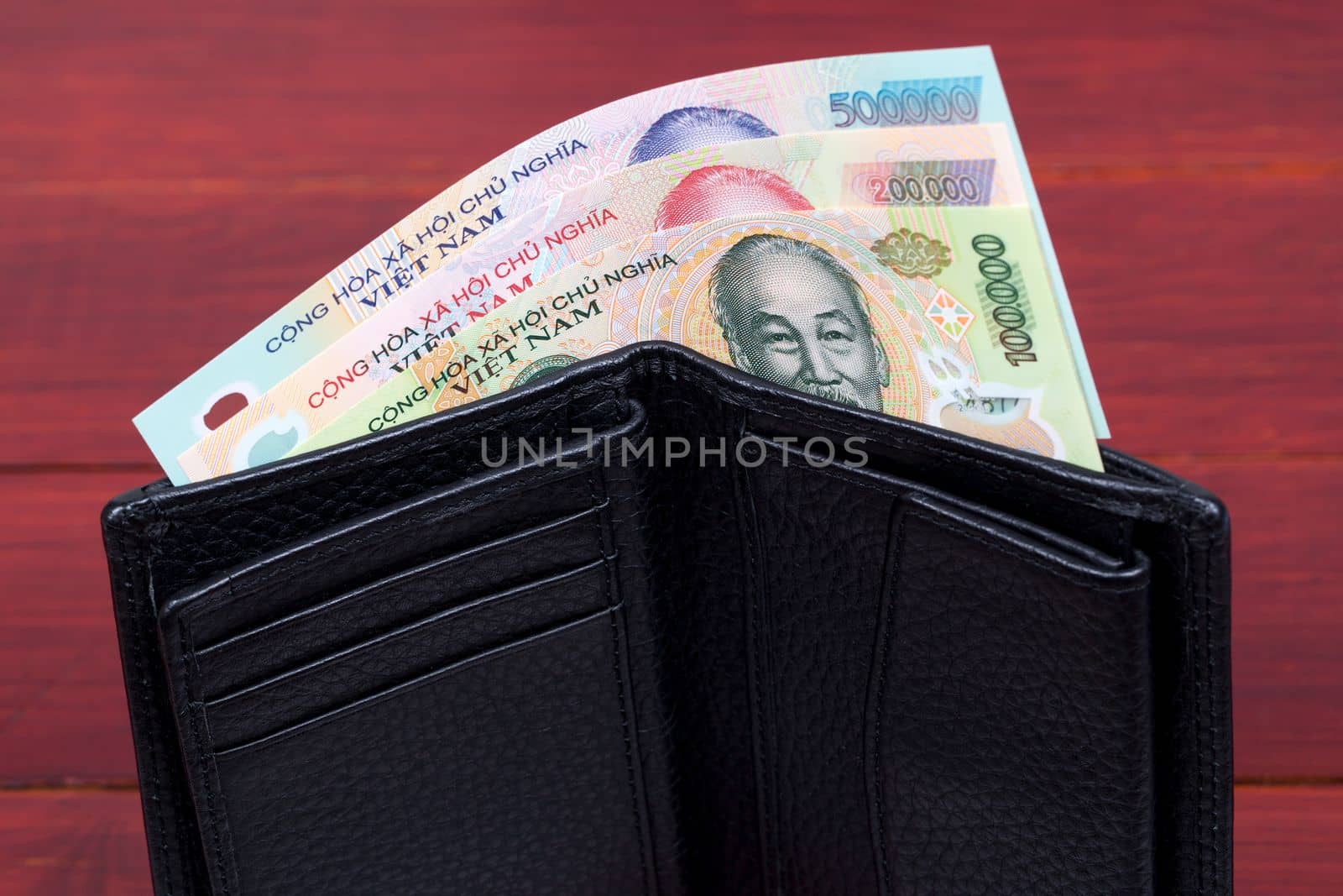 Vietnamese money - dong in the black wallet by johan10