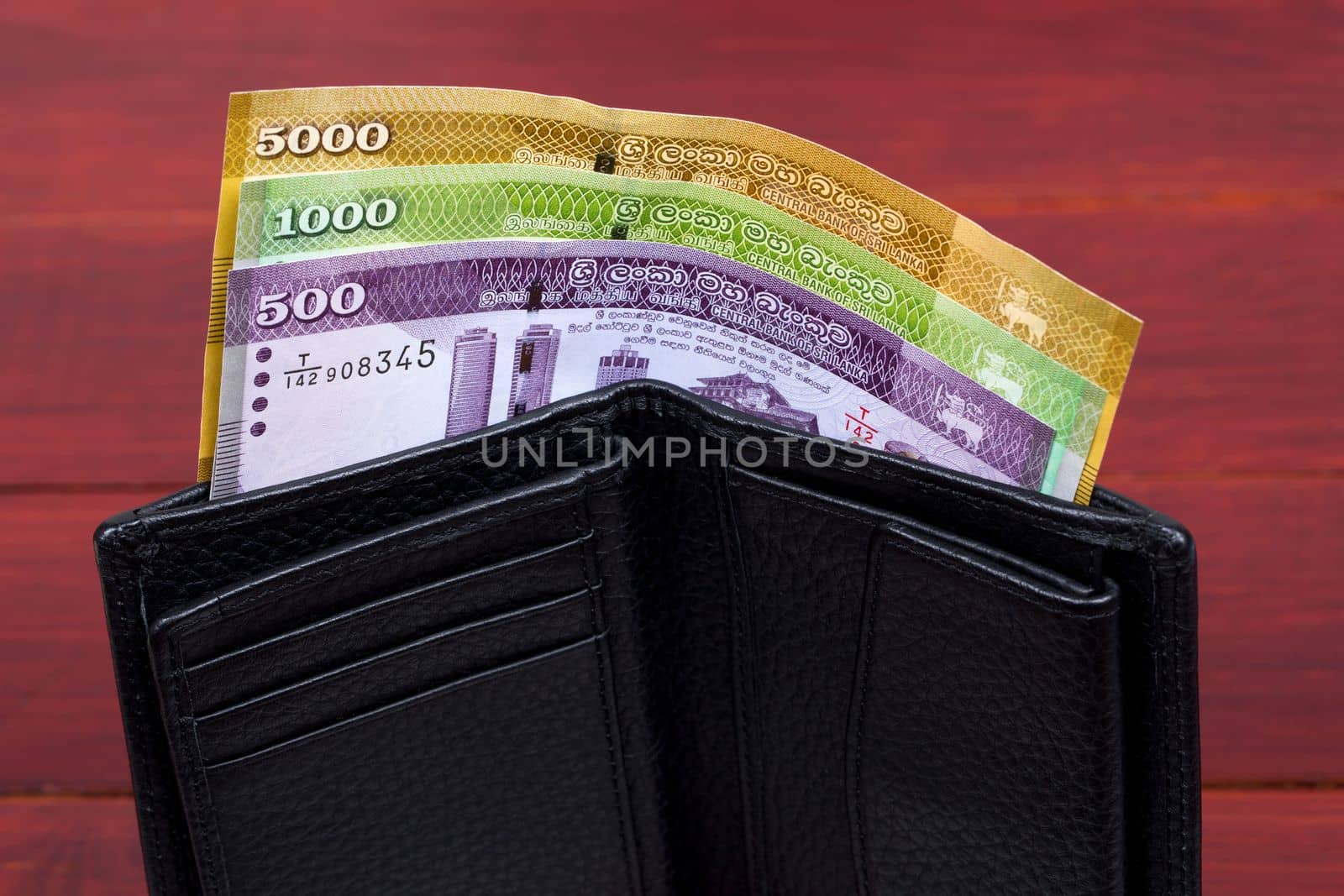 Sri Lankan money - rupee in the black wallet