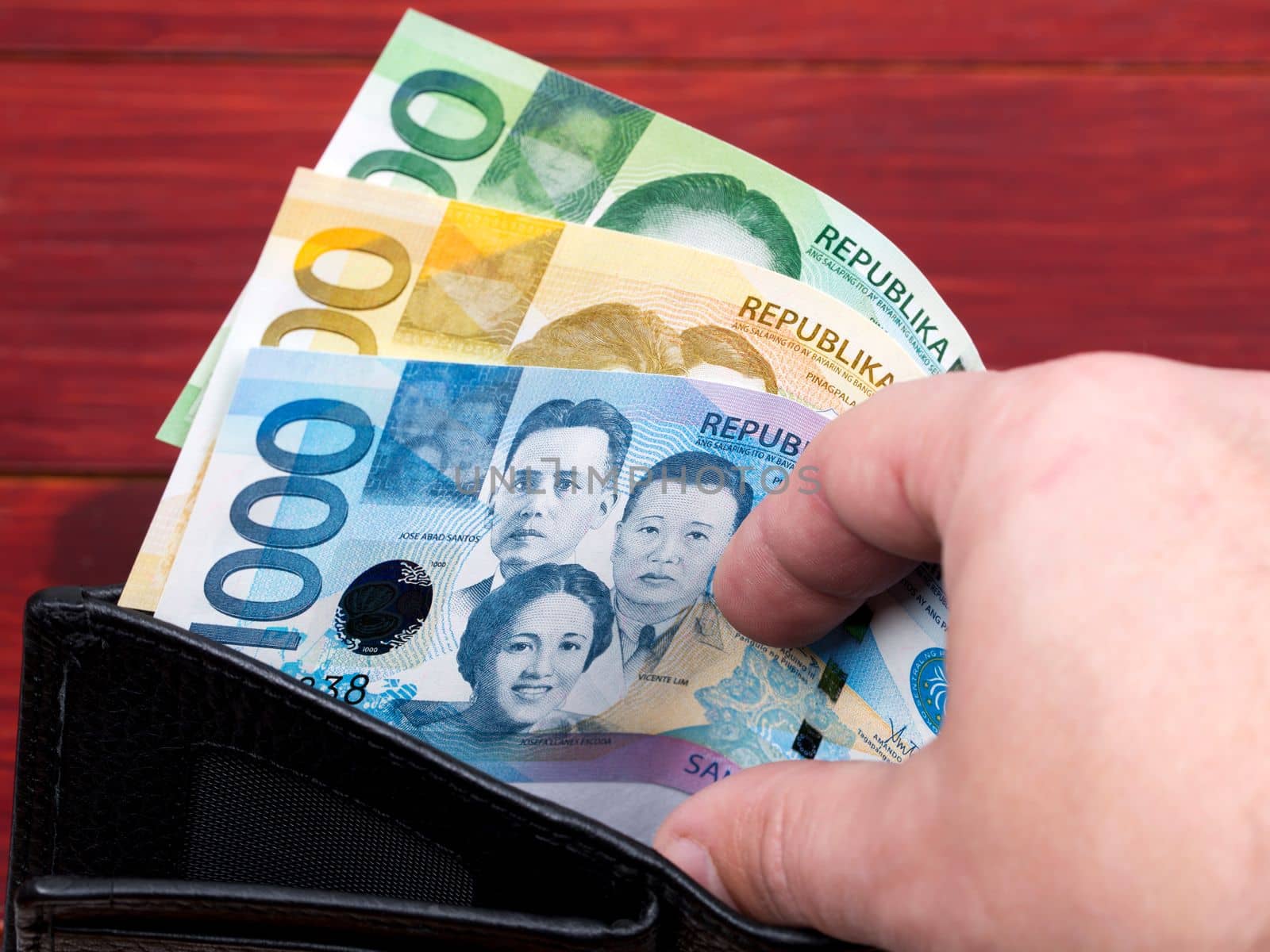 Philippine money - peso in the black wallet by johan10