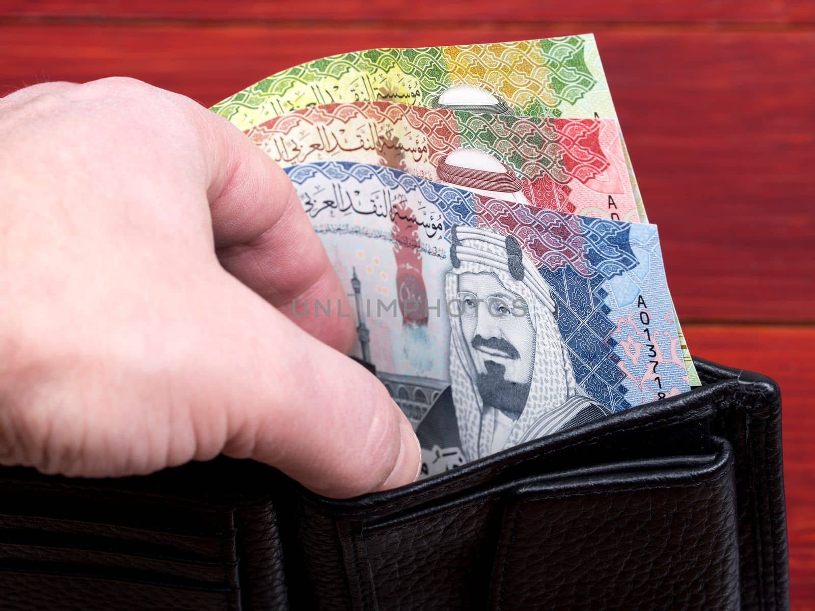 Saudi Arabia money - riyal in the black wallet	