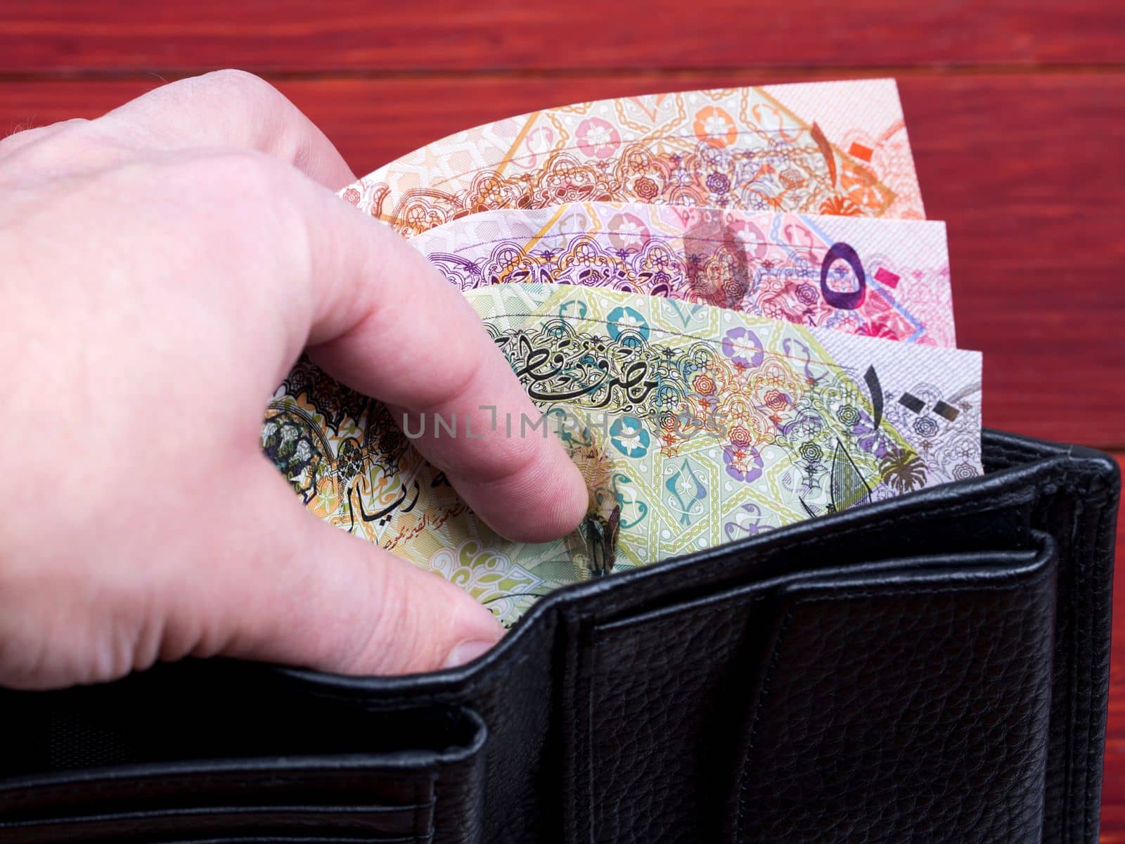 Qatari money - Riyal  in the black wallet