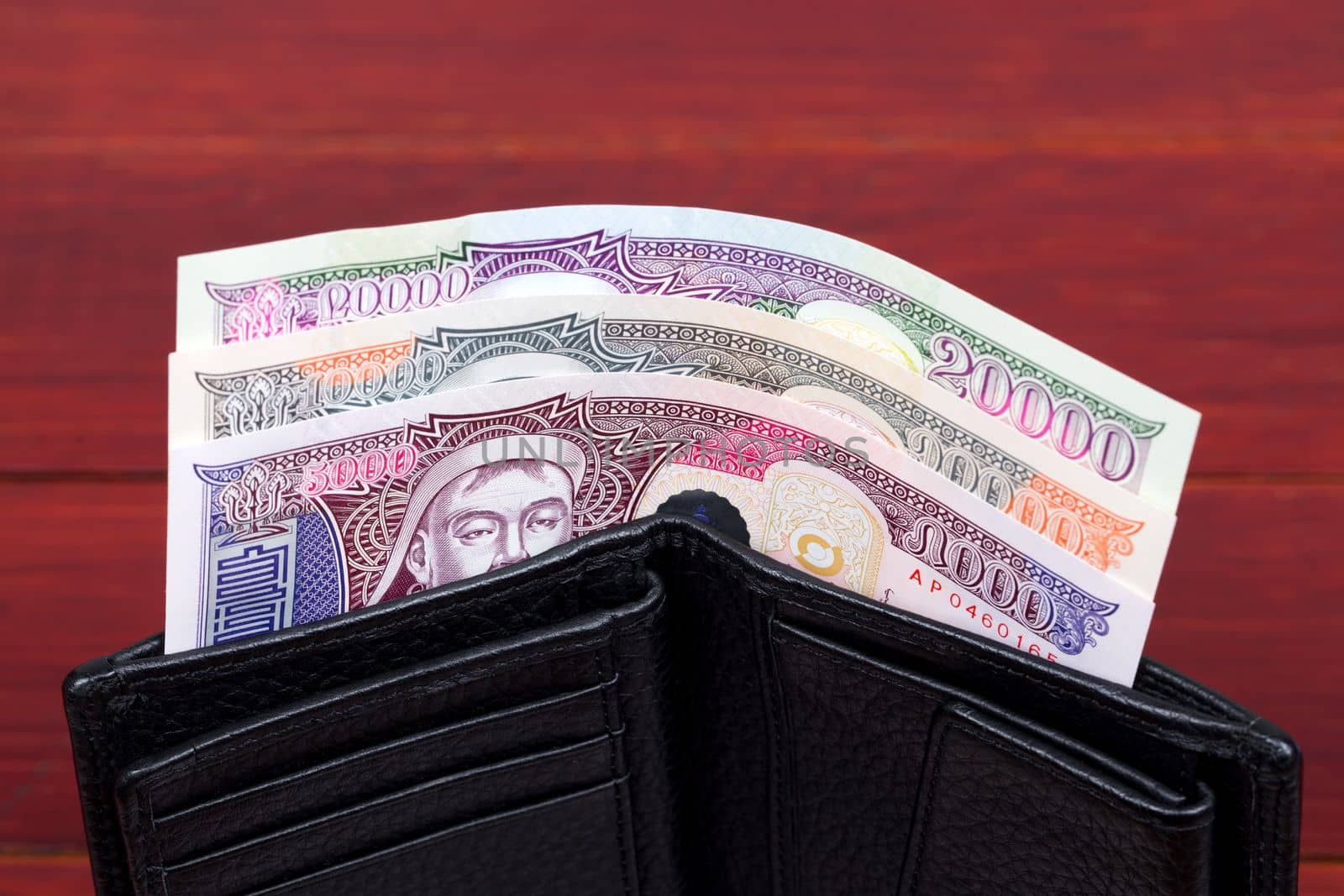 Mongolian money in the black wallet by johan10
