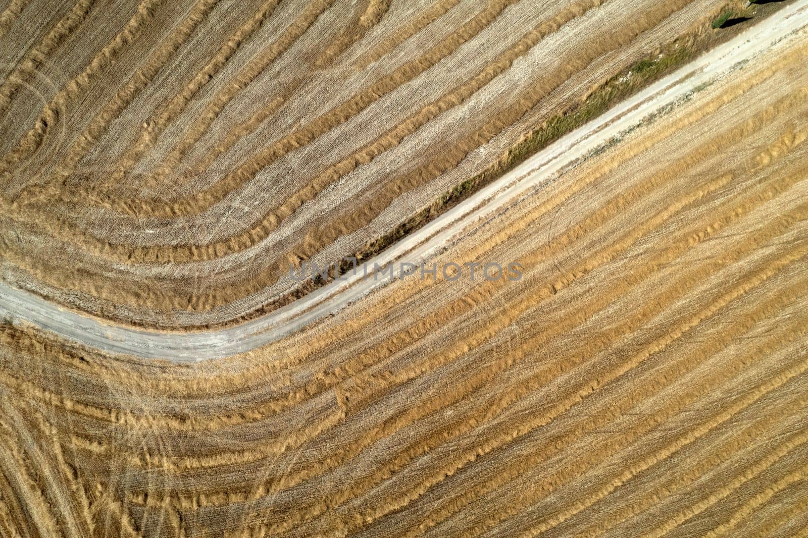 Aerial shot of a straw field left to dry 
 by fotografiche.eu