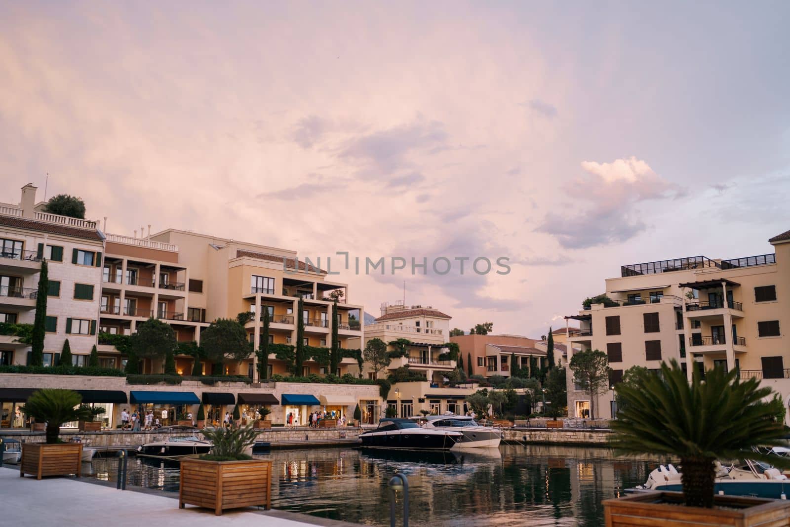 Club houses near the marina at sunset. Porto. Montenegro. High quality photo