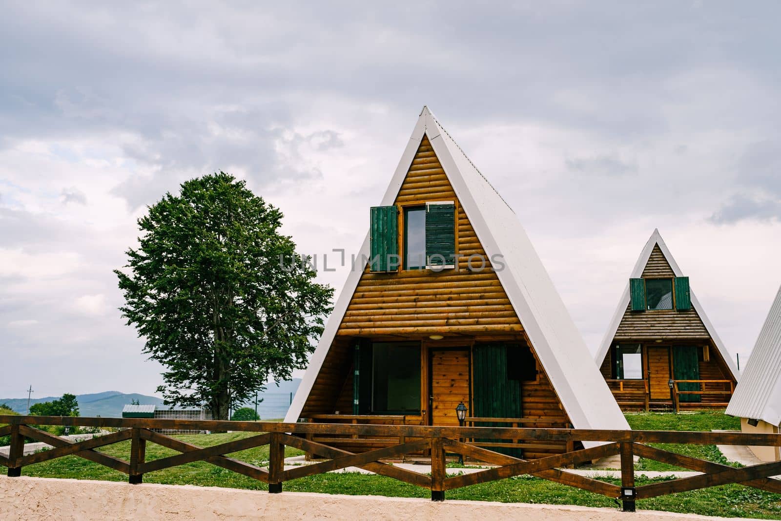 Triangular wooden two-story houses in Durmitor National Park. High quality photo