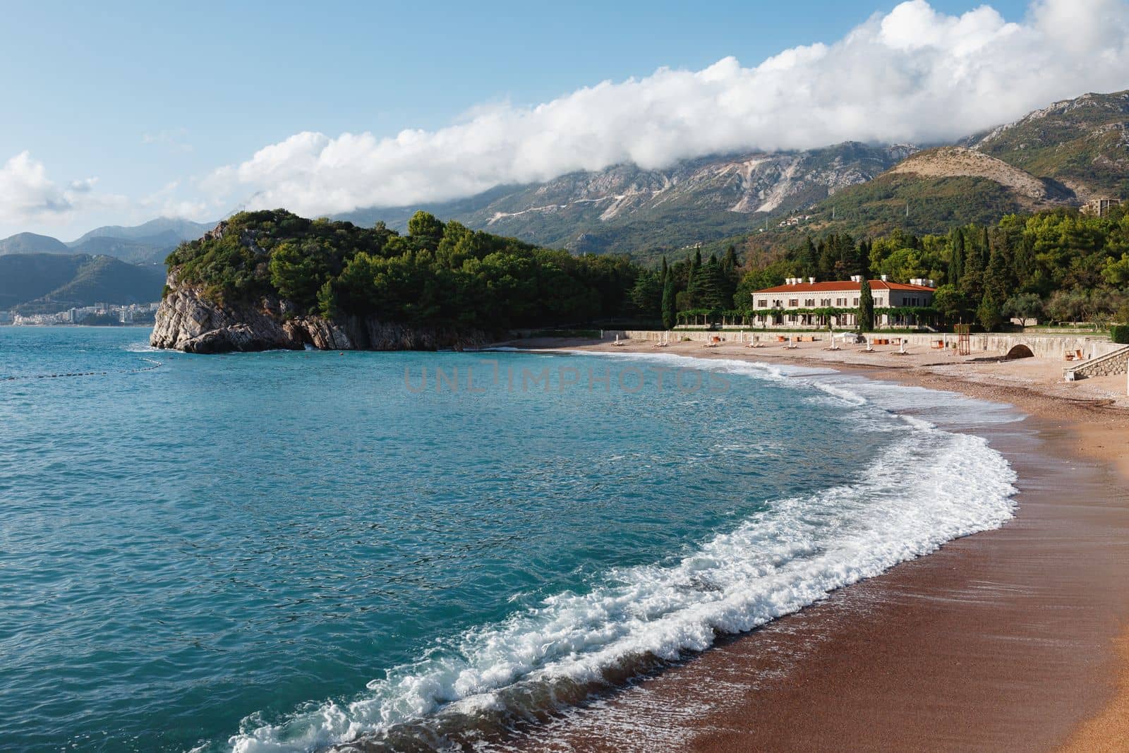 Azure surf on the royal beach near Villa Milocer. Montenegro. High quality photo