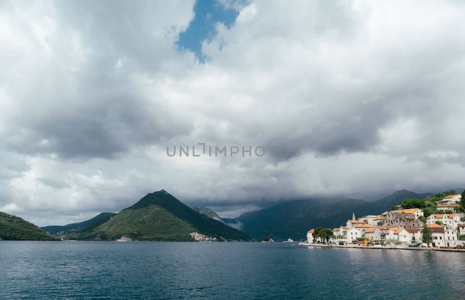 Perast coast against the background of mountains. Montenegro. High quality photo