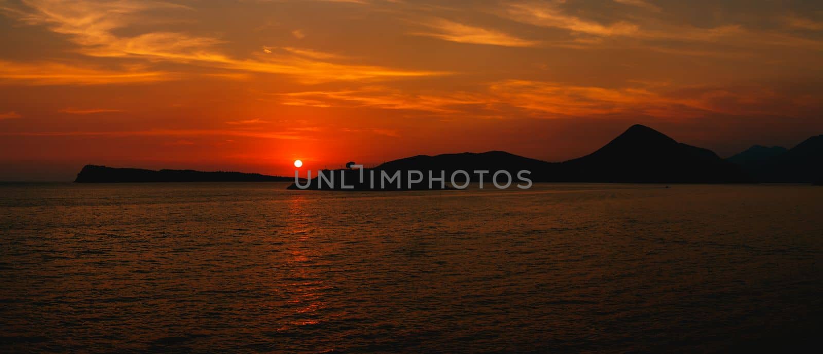 Red sunset over Mamula island. Montenegro. High quality photo