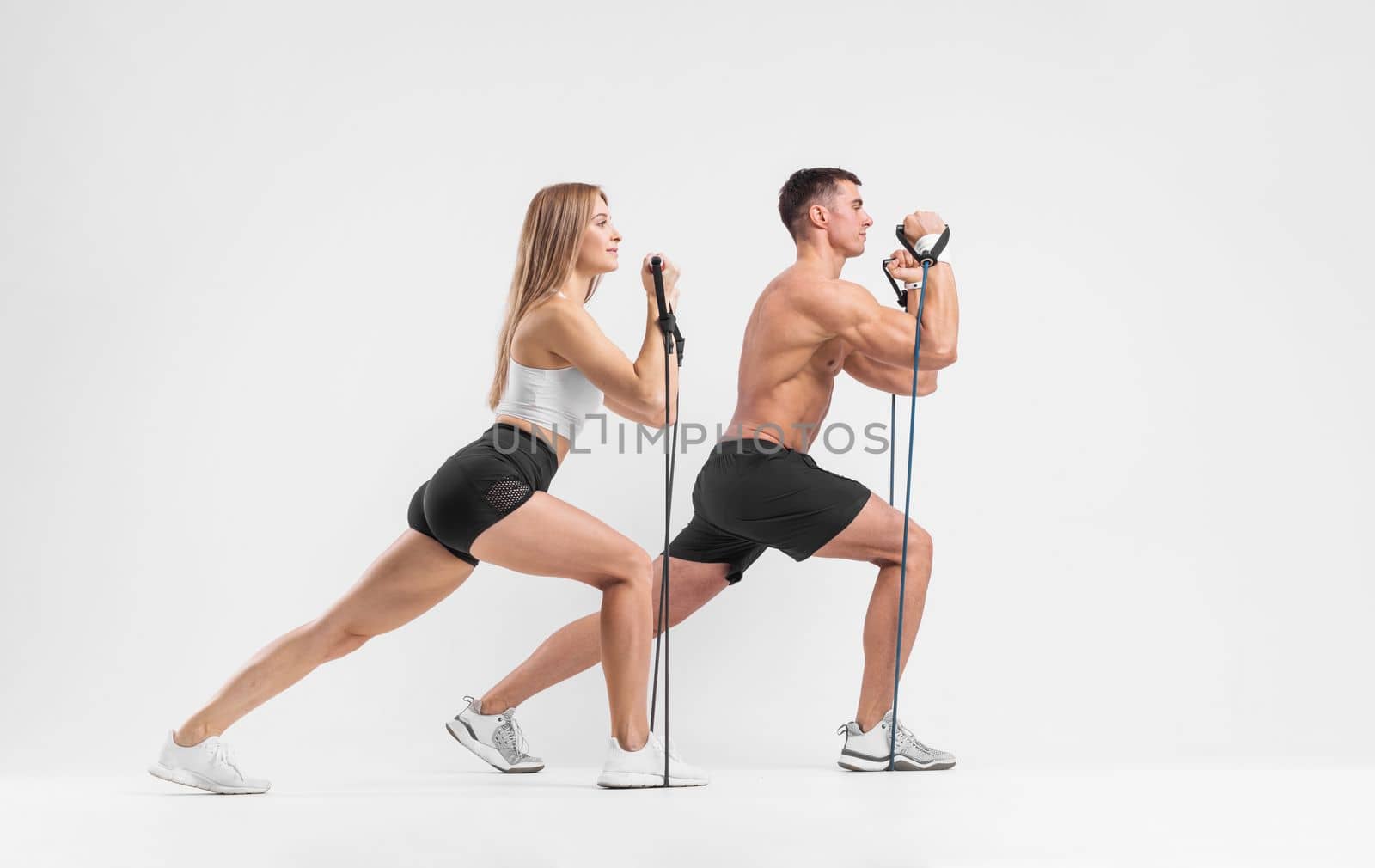 Fit couple at the gym isolated on white background. Fitness concept. Healthy life style