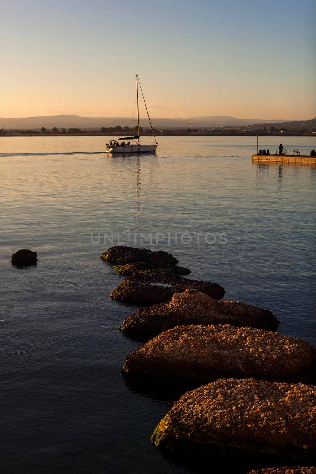 Rock on the sea at sunset in Ortigia, Syracuse