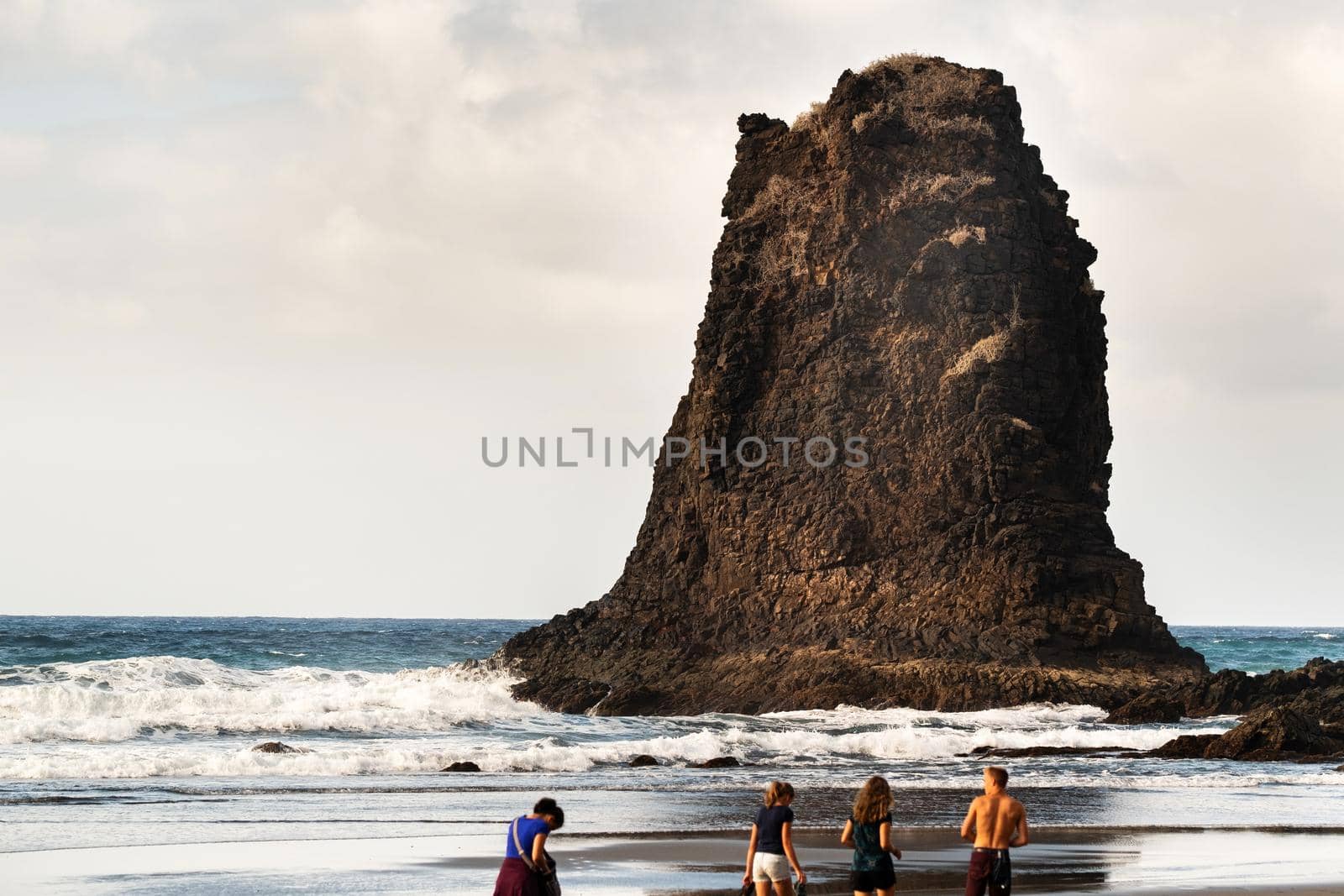 People on the sandy beach of Benijo on the island of Tenerife.Spain.