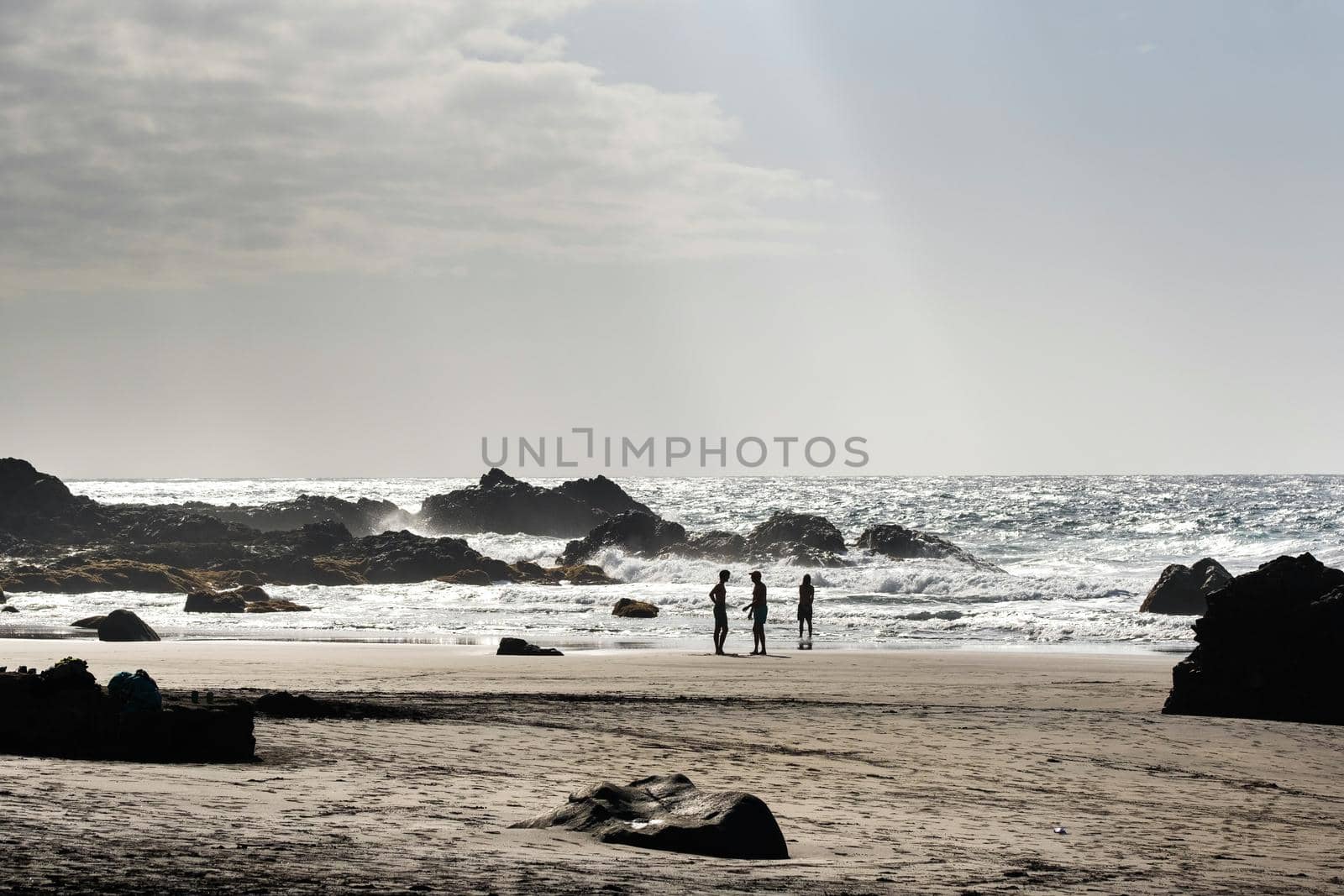 People on the sandy beach of Benijo on the island of Tenerife.Spain.