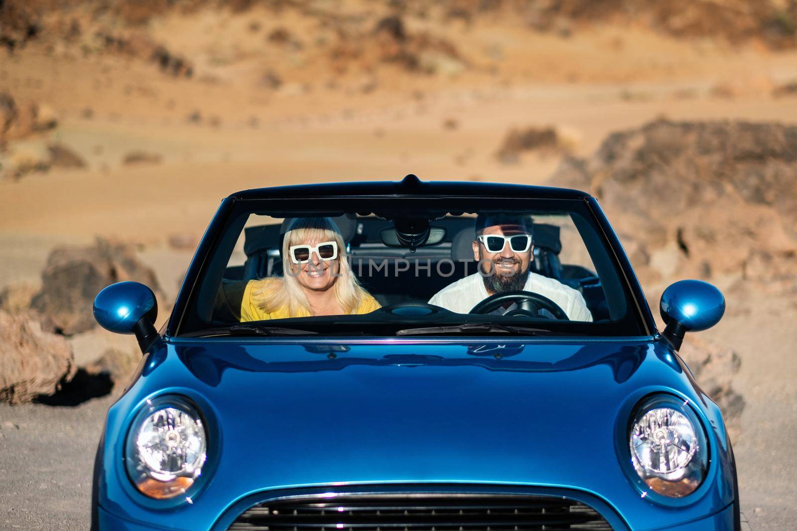 a pair of glasses sit in a car on the island of Tenerife in the crater of the Teide volcano, Spain by Lobachad