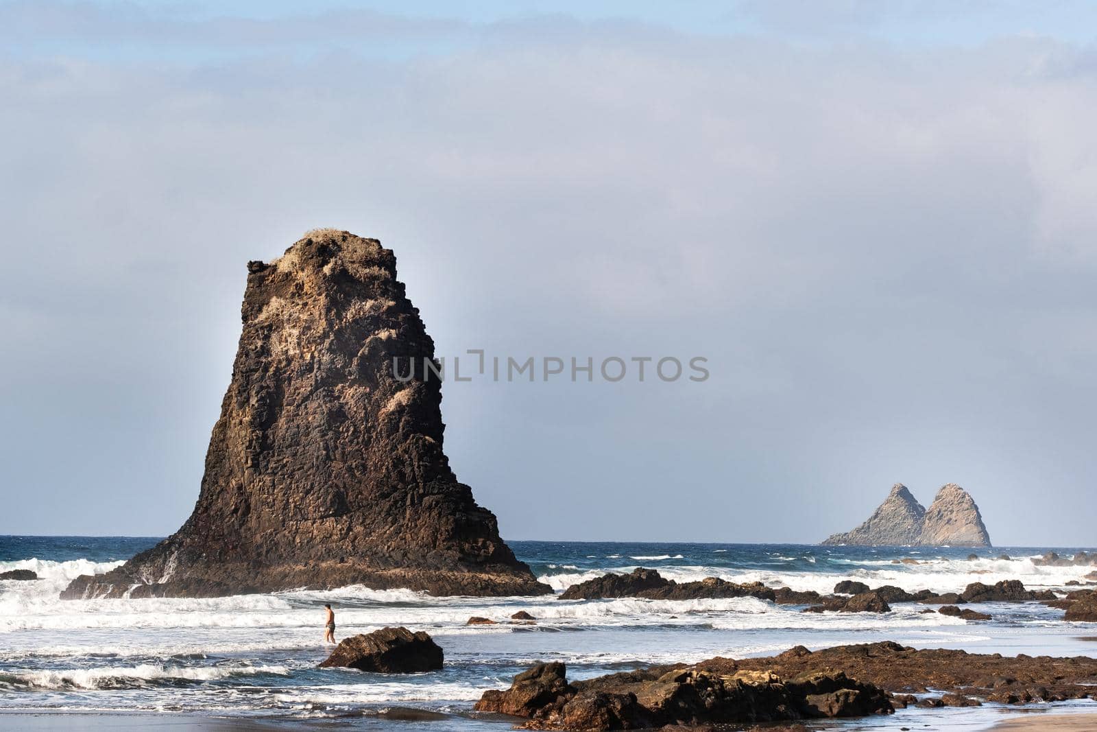 People on the sandy beach of Benijo on the island of Tenerife.Spain by Lobachad