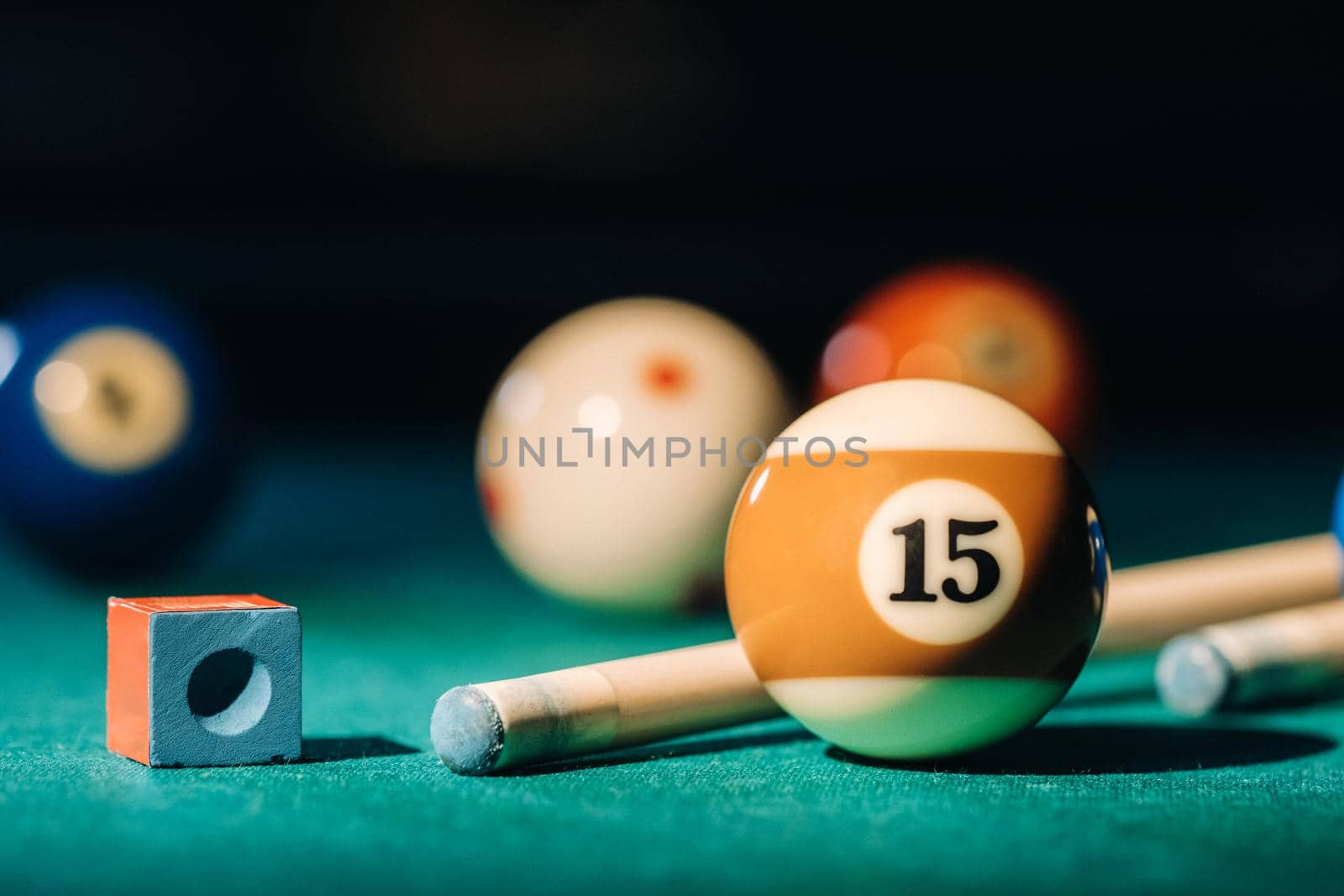 Billiard table with green surface and balls in the billiard club.Pool Game.