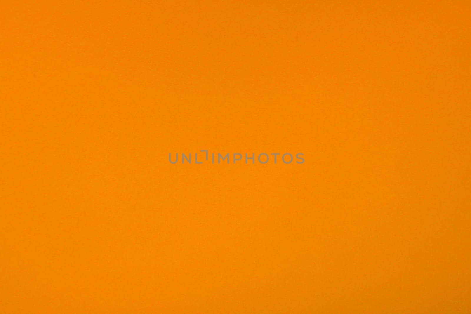 Orange background with paper texture, horizontal, blank space.