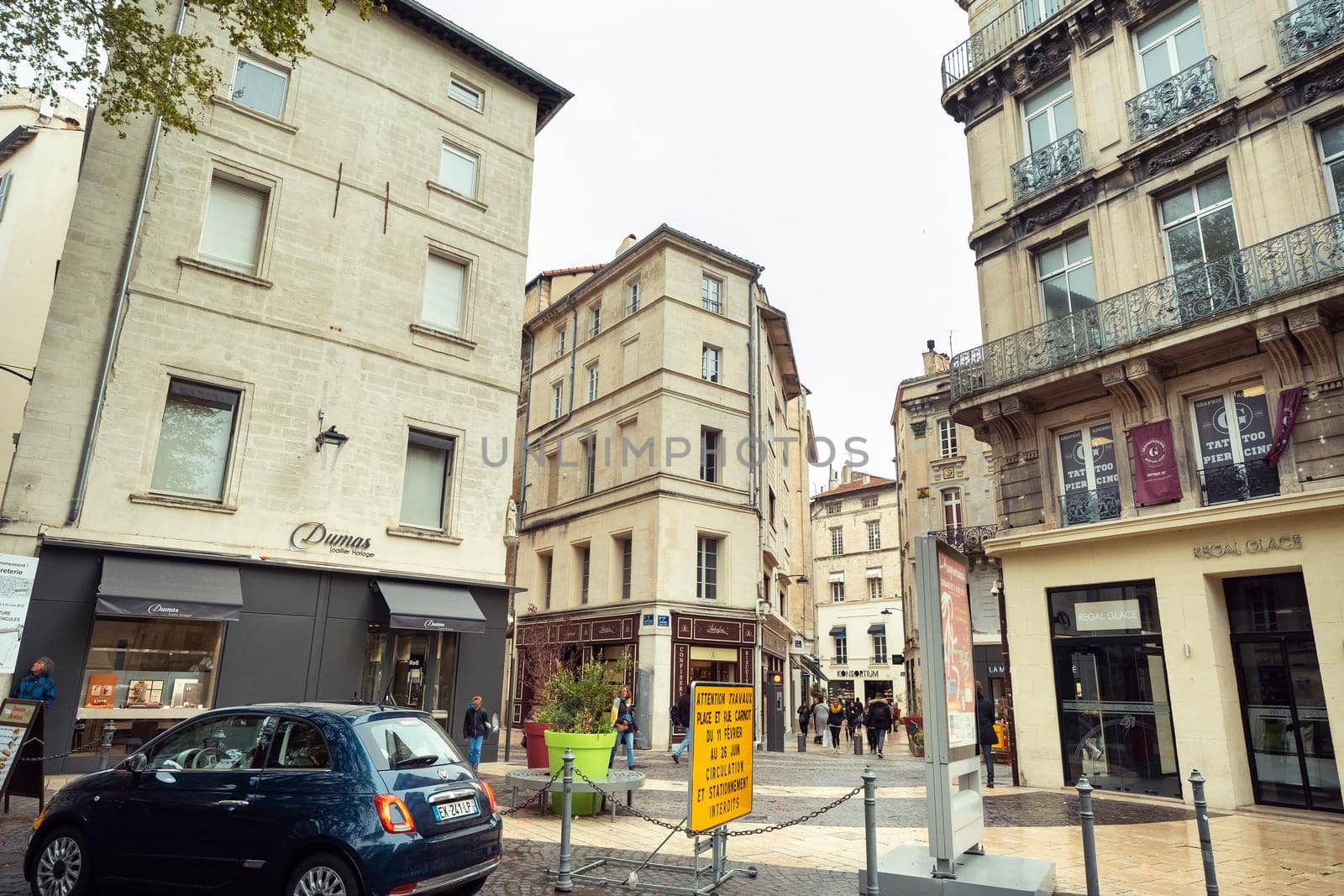 Avignon, France-April 6, 2019: Old Town Street and tourists in the center of Avignon.