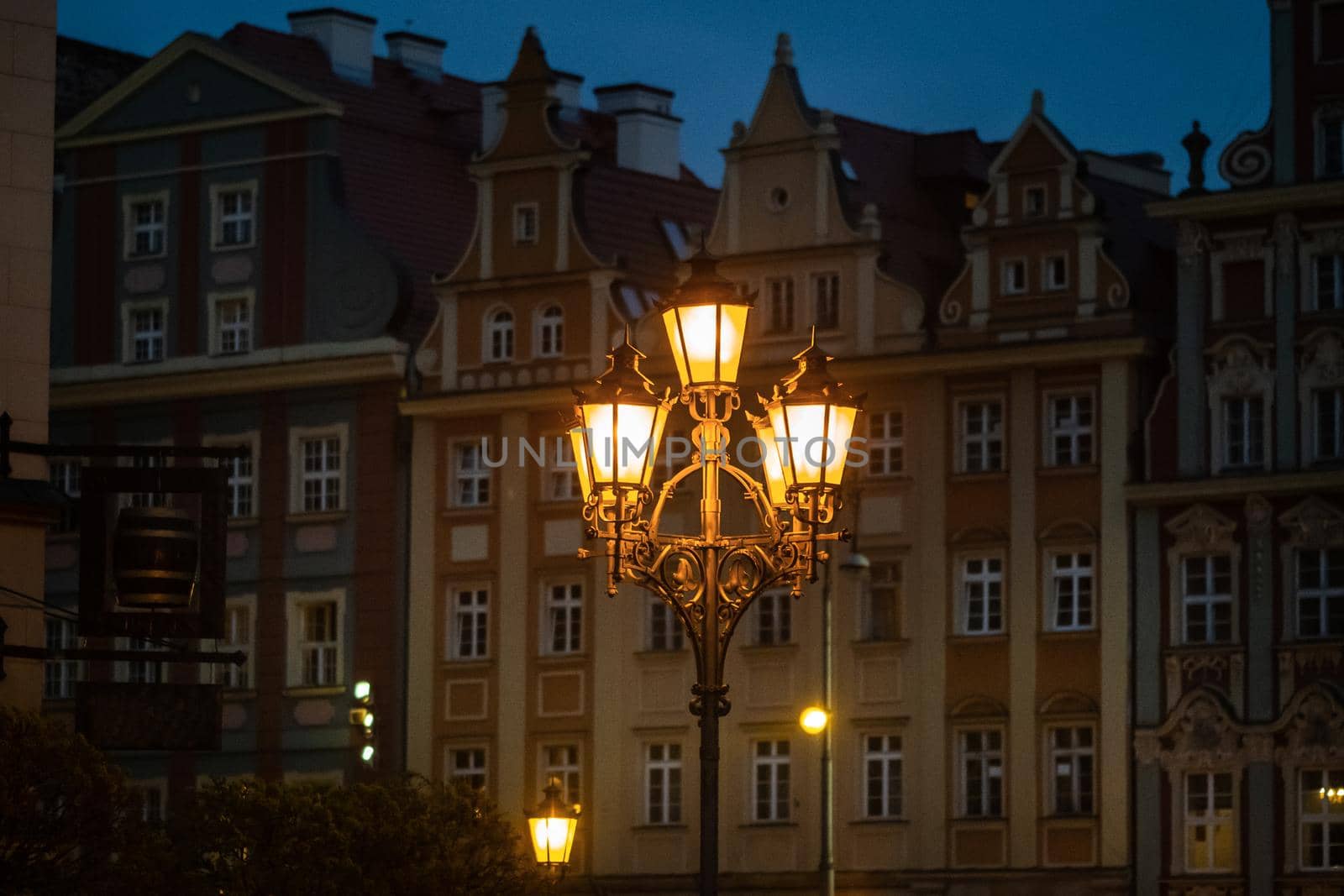 Night view of a burning lantern in the Old Town of Wroclaw. Poland.