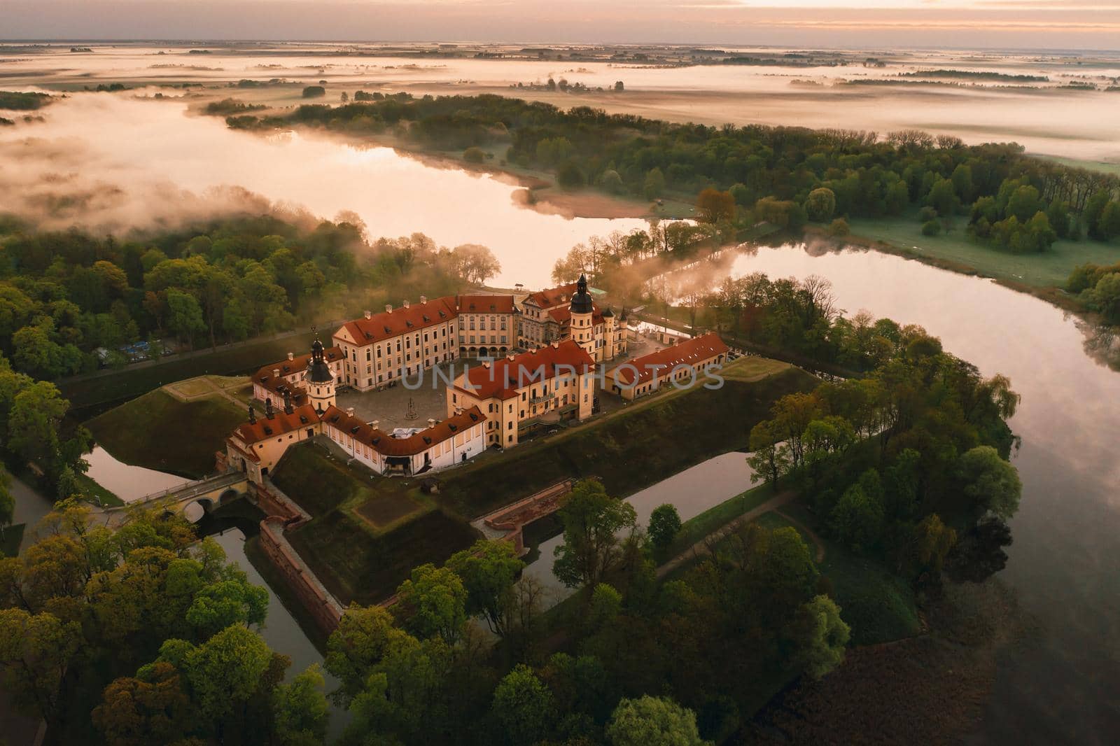 Nesvizh castle is a residential castle of the Radziwill family in Nesvizh, Belarus, with a beautiful view from above at dawn.