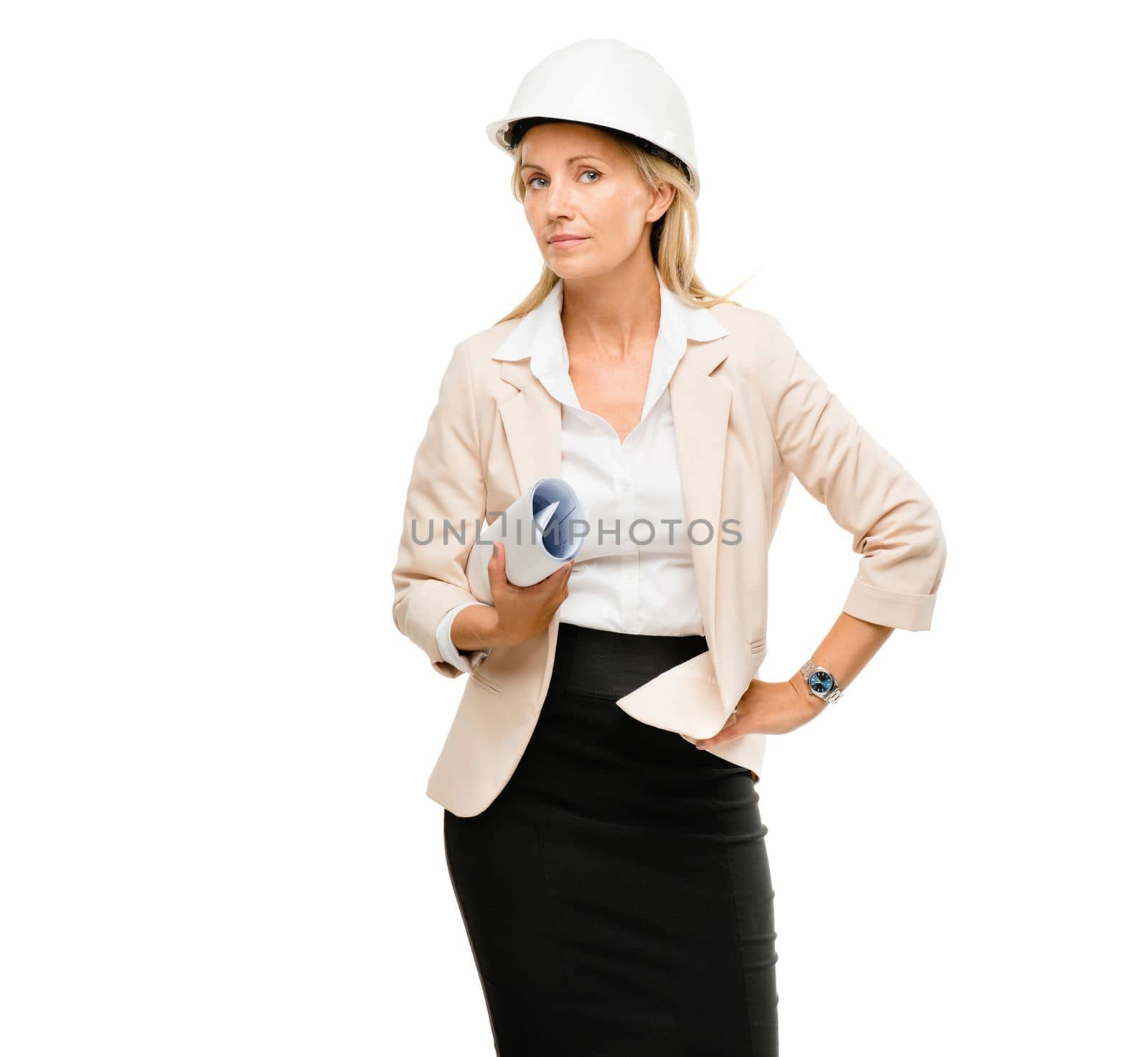 A woman of many talents. a mature businesswoman holding construction blueprints. by YuriArcurs