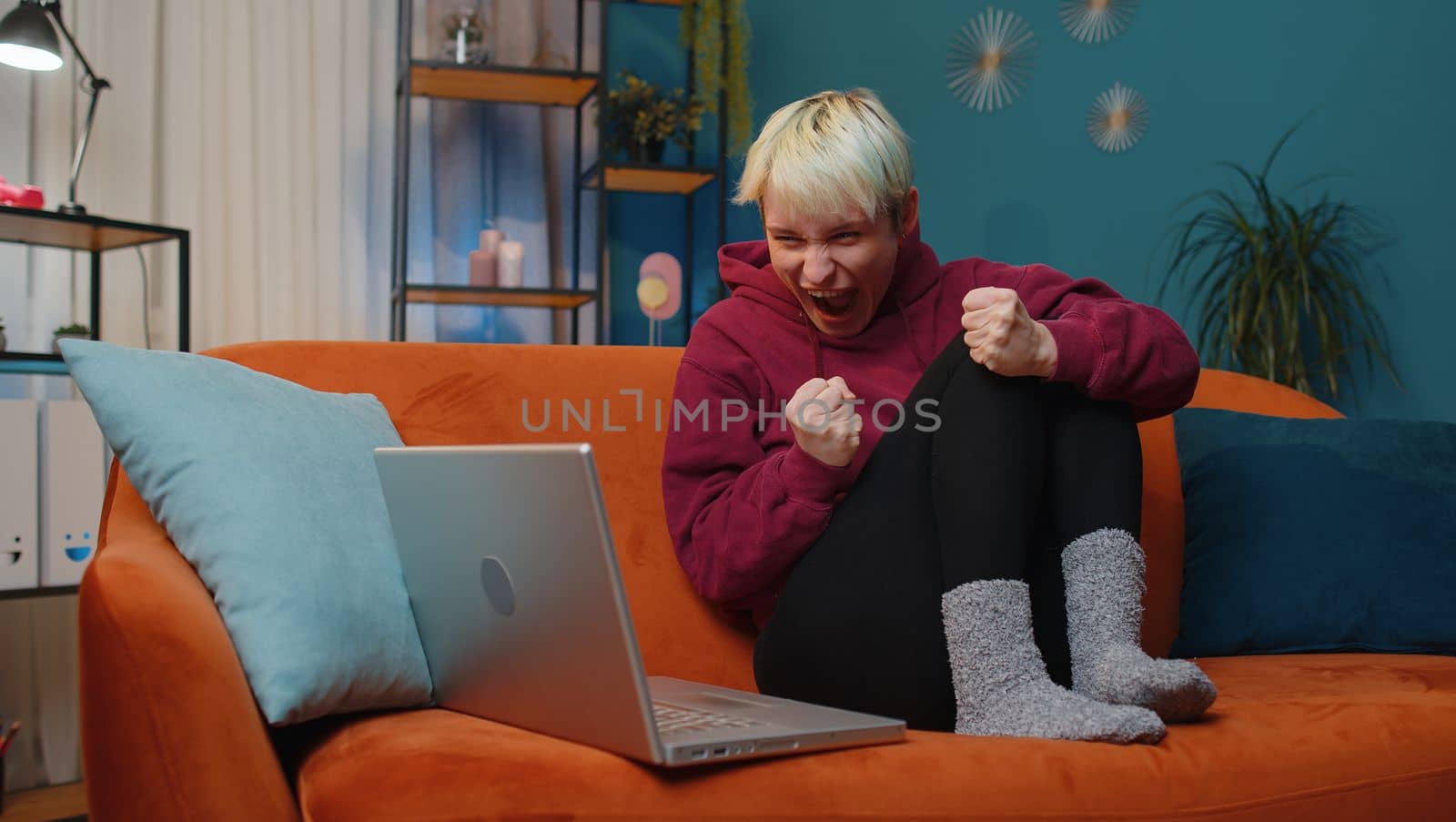 Amazed woman use laptop computer, receive good news message, shocked by victory, celebrate win by efuror