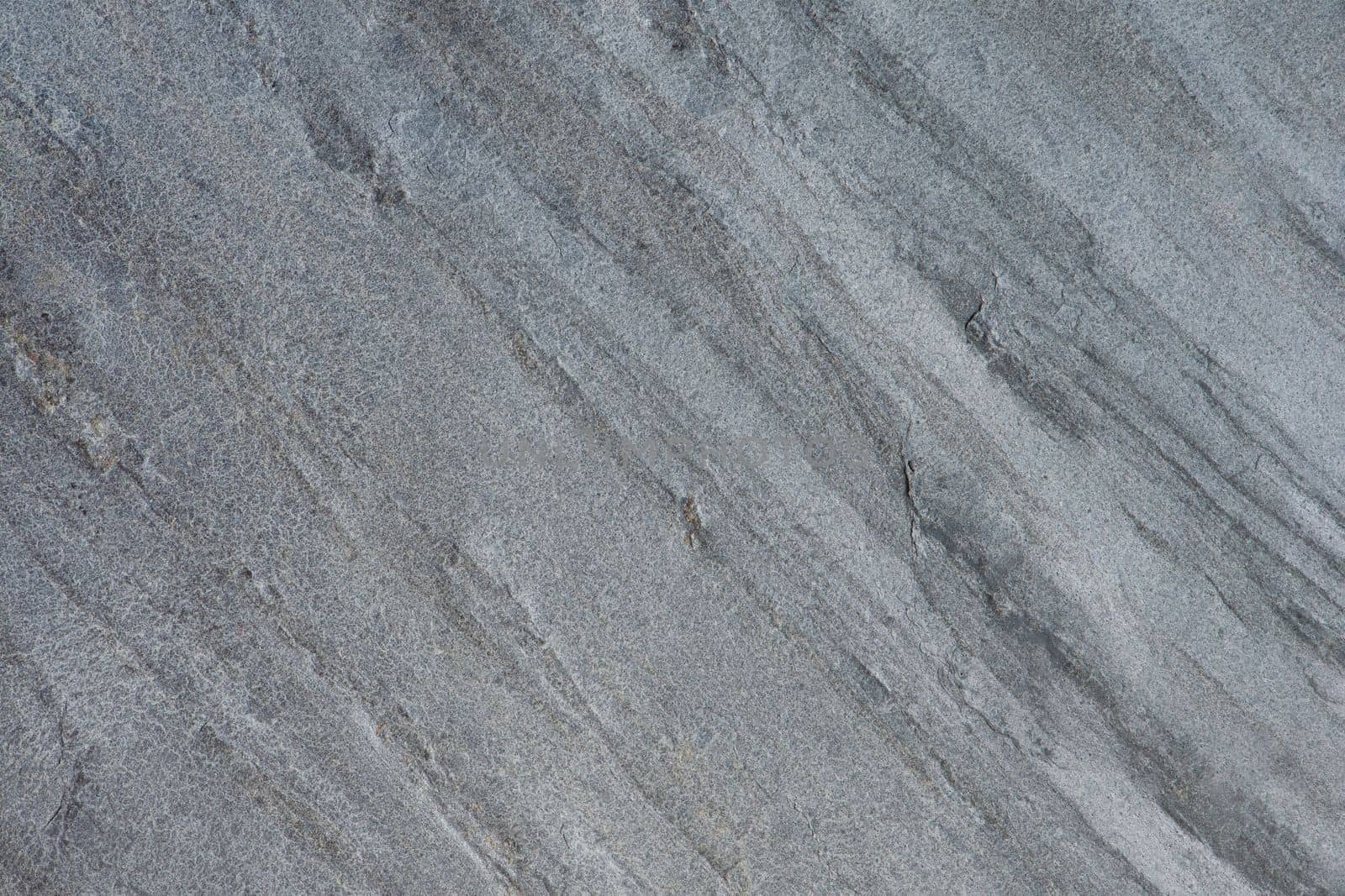 Samples of gray stone with a wavy pattern for the interior. Texture of natural stone. Natural stone surface for flooring or wall decoration. by SERSOL