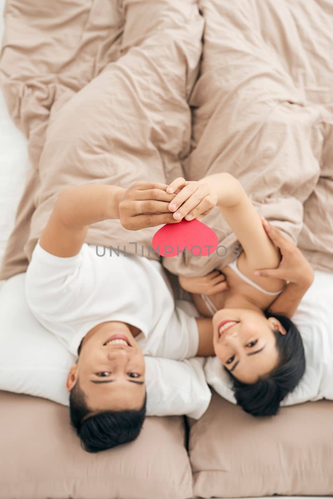 Young loving couple in the bed