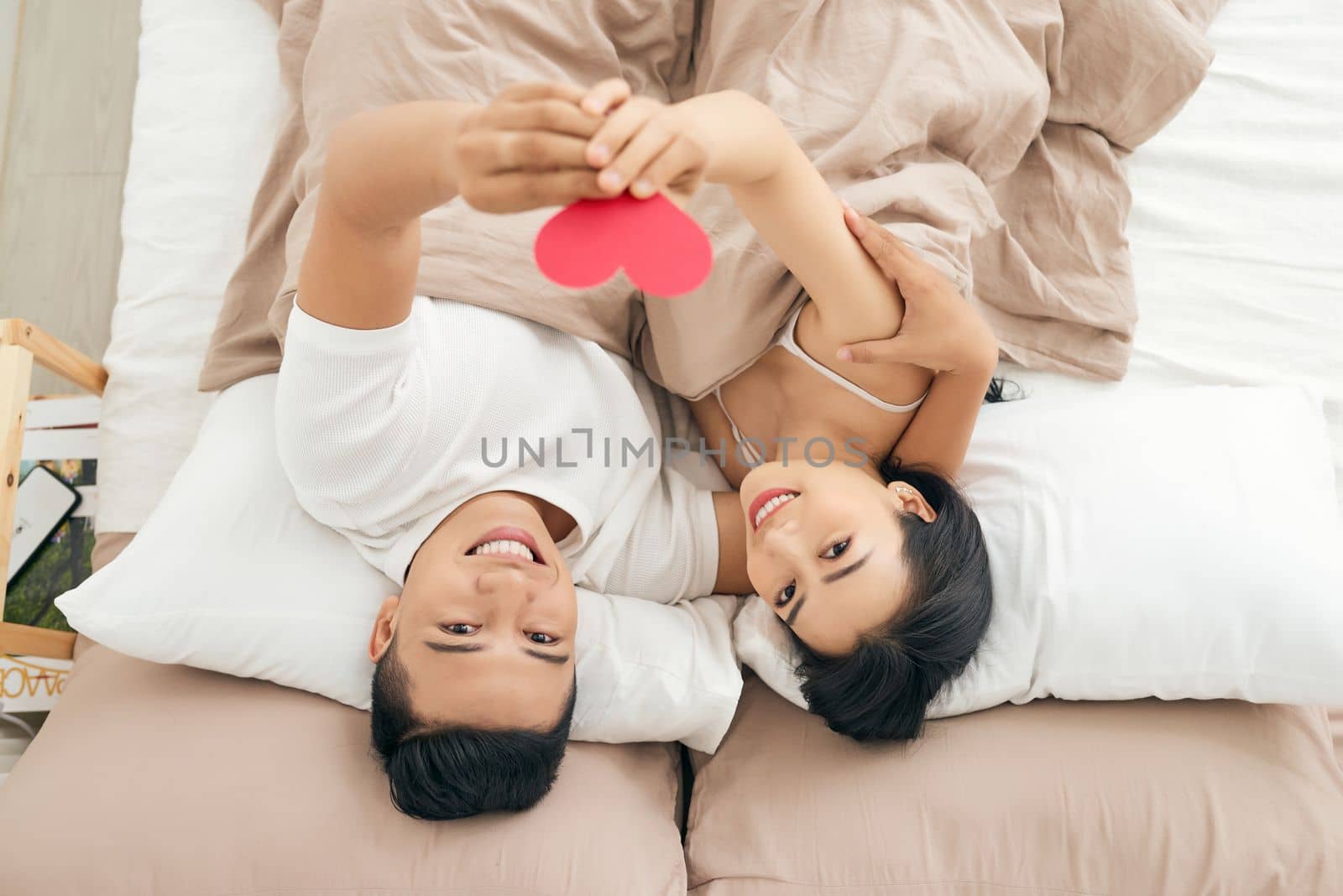 Young loving couple in the bed