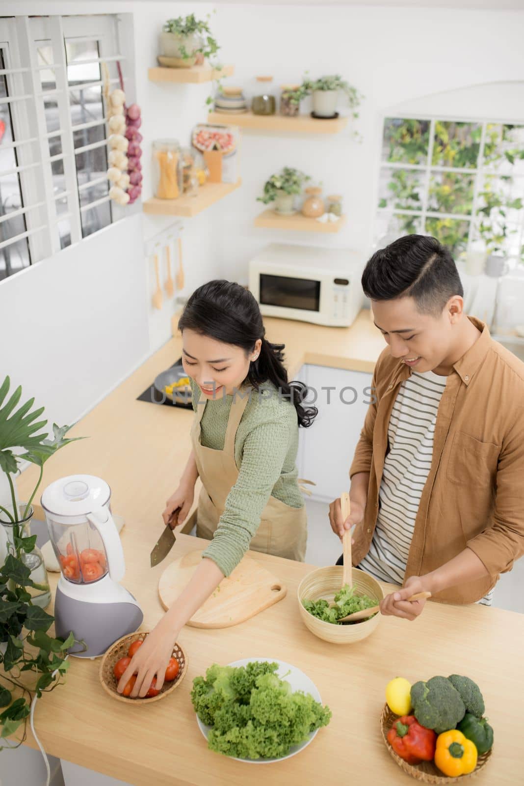  Young asian man and woman have romantic time while staying at home.