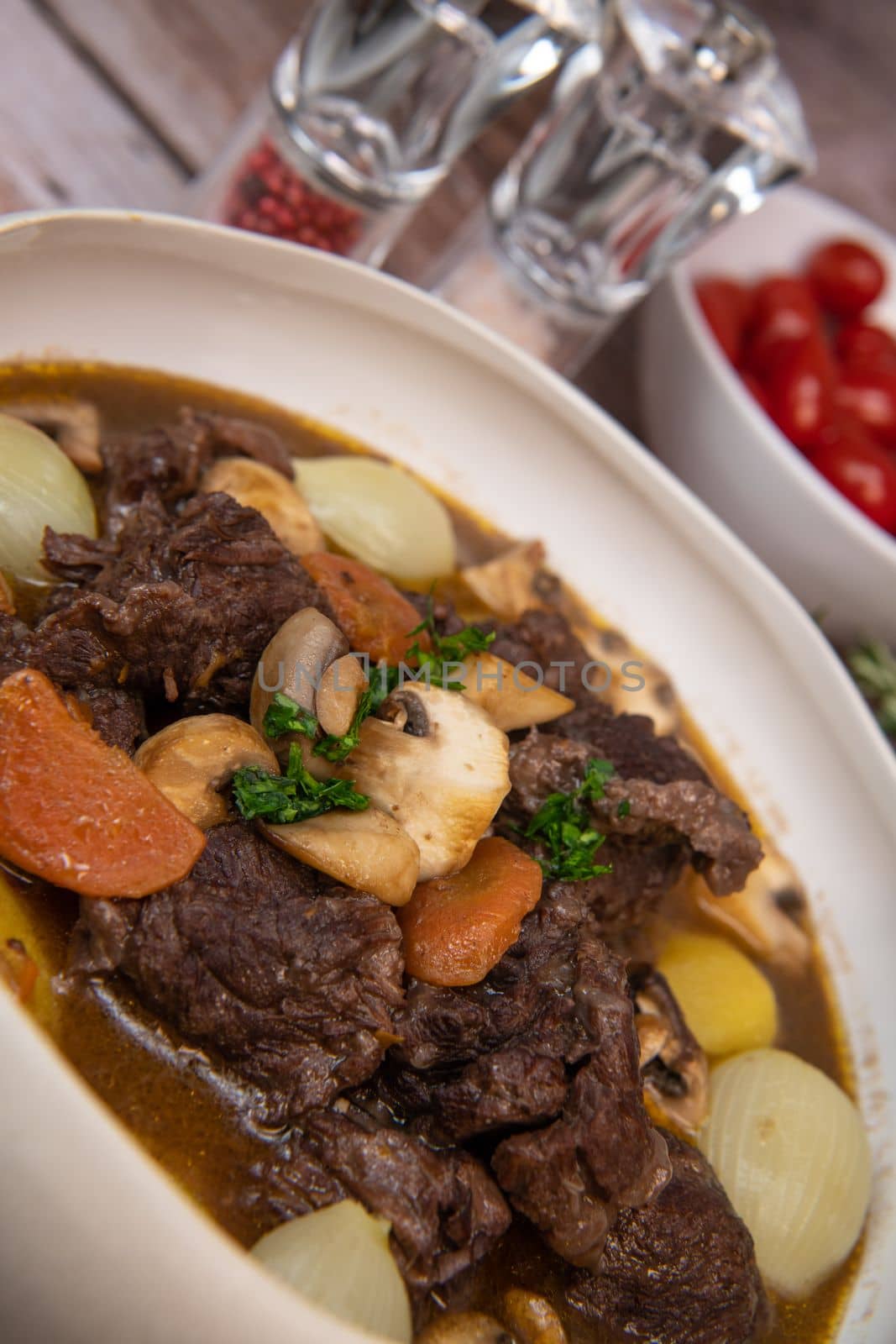 Beef bourguignon recipe, beef stew with wine sauce and vegetables. High quality photo